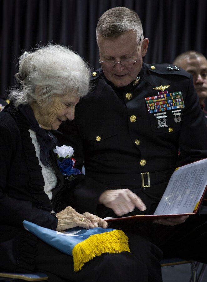Maj. Gen. Bradley S. James, commander of Marine Forces Reserve and Marine Forces North, reads the Medal of Honor citation for Sgt. Alfredo Cantu Gonzalez to his mother, Dolia Gonzalez, at the Freddy Gonzalez Elementary school in Edinburg, Texas, Jan. 14, 2019. Gonzalez served two tours in the Vietnam War and was killed on Feb. 4, 1968. (U.S. Marine Corps photo by Cpl. Tessa D. Watts)