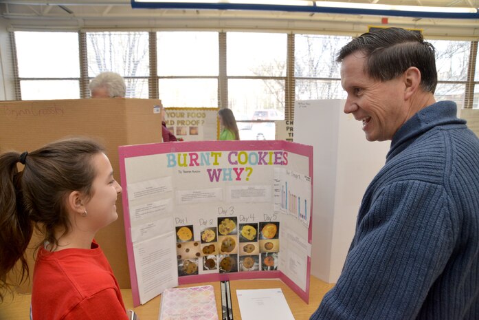 Russ Dunford, who manages strategic plans and integration at Huntsville Center, interviews sixth-grader Hannah Austin during Monte Sano Elementary School’s science fair for sixth-grade honor students Jan. 10, 2019, in Huntsville, Alabama.