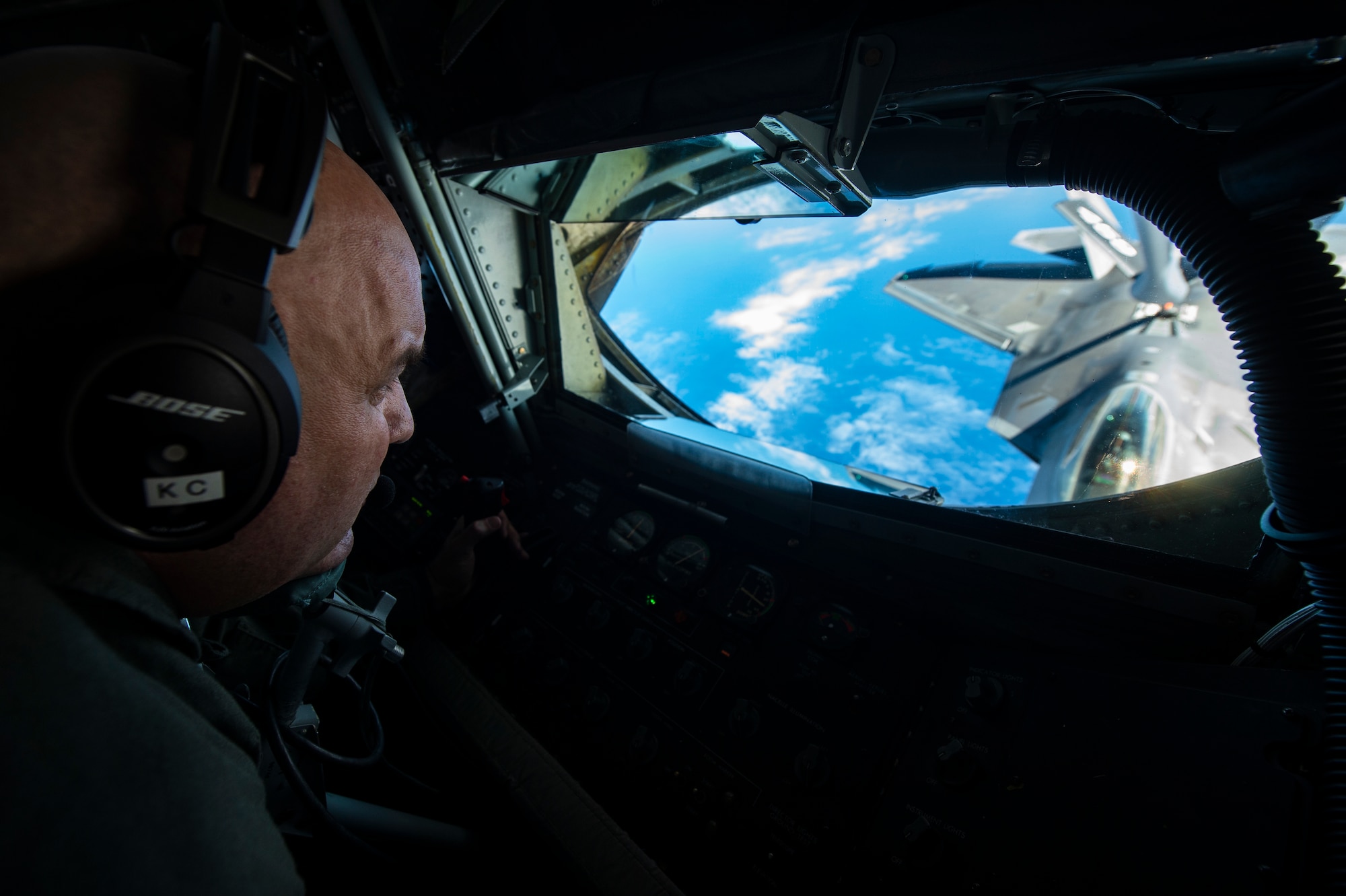 U.S. Air Force Reserve Master Sgt. Ken Clonts, a 756th Air Refueling Squadron in-flight refueler, conducts aerial refueling with an F-22 Raptor from the 199th Fighter Squadron near Joint Base Pearl Harbor-Hickam, Hawaii, Jan. 15, 2019.