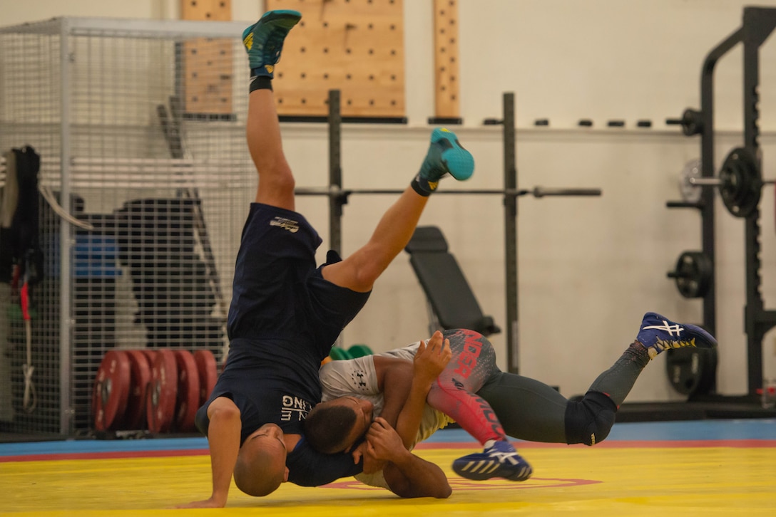 A wrestler flips another wrestler