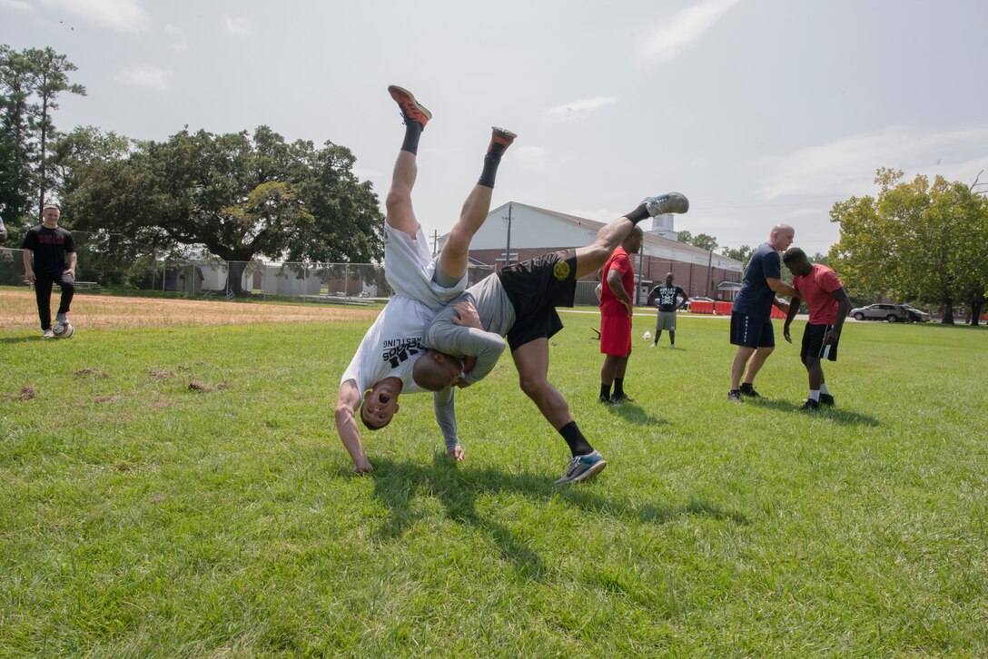 A man throws another to the ground