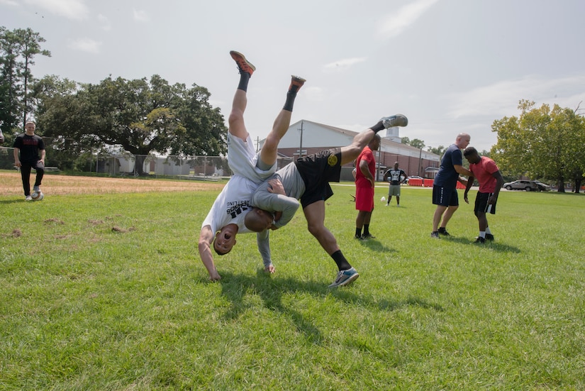 A man throws another to the ground