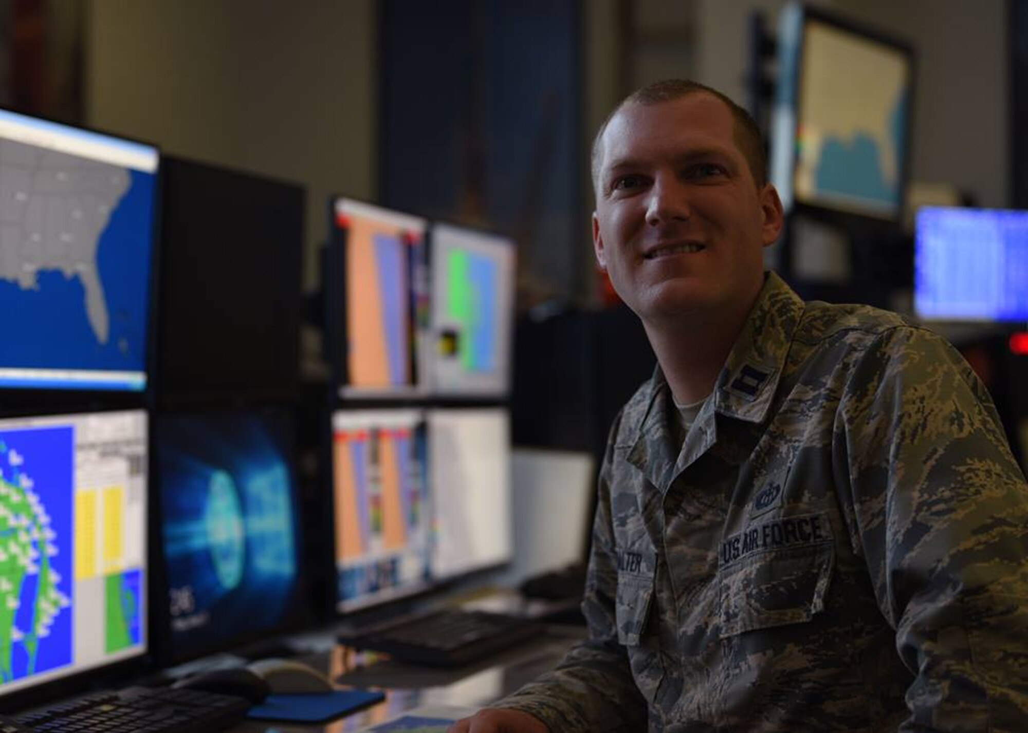 Capt. Matthew Walter, 45th Weather Squadron Airfield and Range Weather Operations flight commander, poses for a photo in the Morrell Operations Center on Jan. 11, 2019, at Cape Canaveral Air Force Station, Fla. Walter is a weather officer who is passionate about severe weather awareness due to experiencing a tornado on his family farm as a child. (U.S. Air Force photo by Airman 1st Class Zoe Thacker)