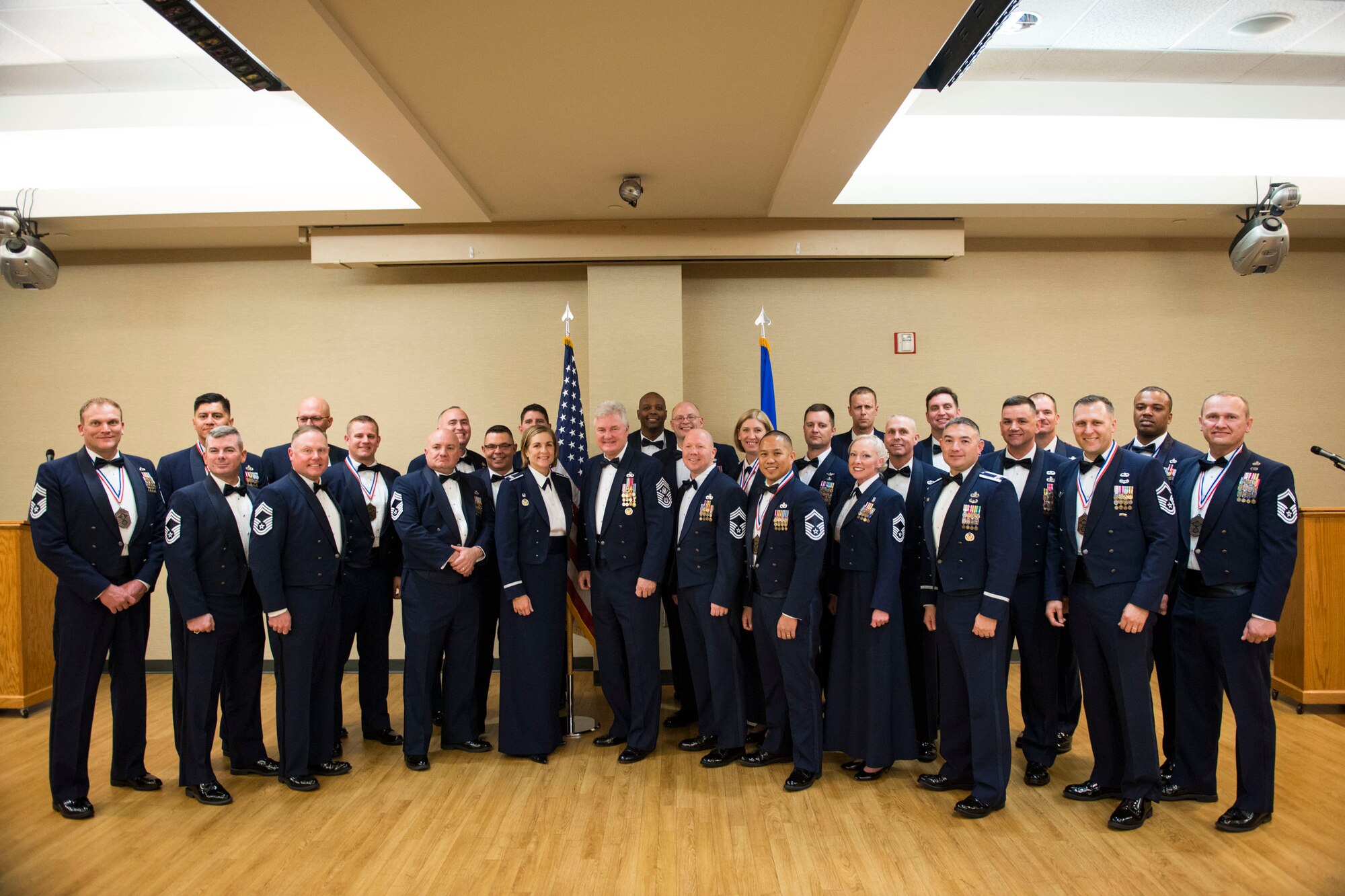 Attendees pose for a photo during a Chief Recognition Ceremony, Jan. 11, 2018, at Moody Air Force Base, Ga. As one of the oldest military traditions, the ceremony recognized members selected for promotion to the rank of chief, a rank which only one percent of the Air Force’s total enlisted force hold. (U.S. Air Force photo by Airman 1st Class Erick Requadt)