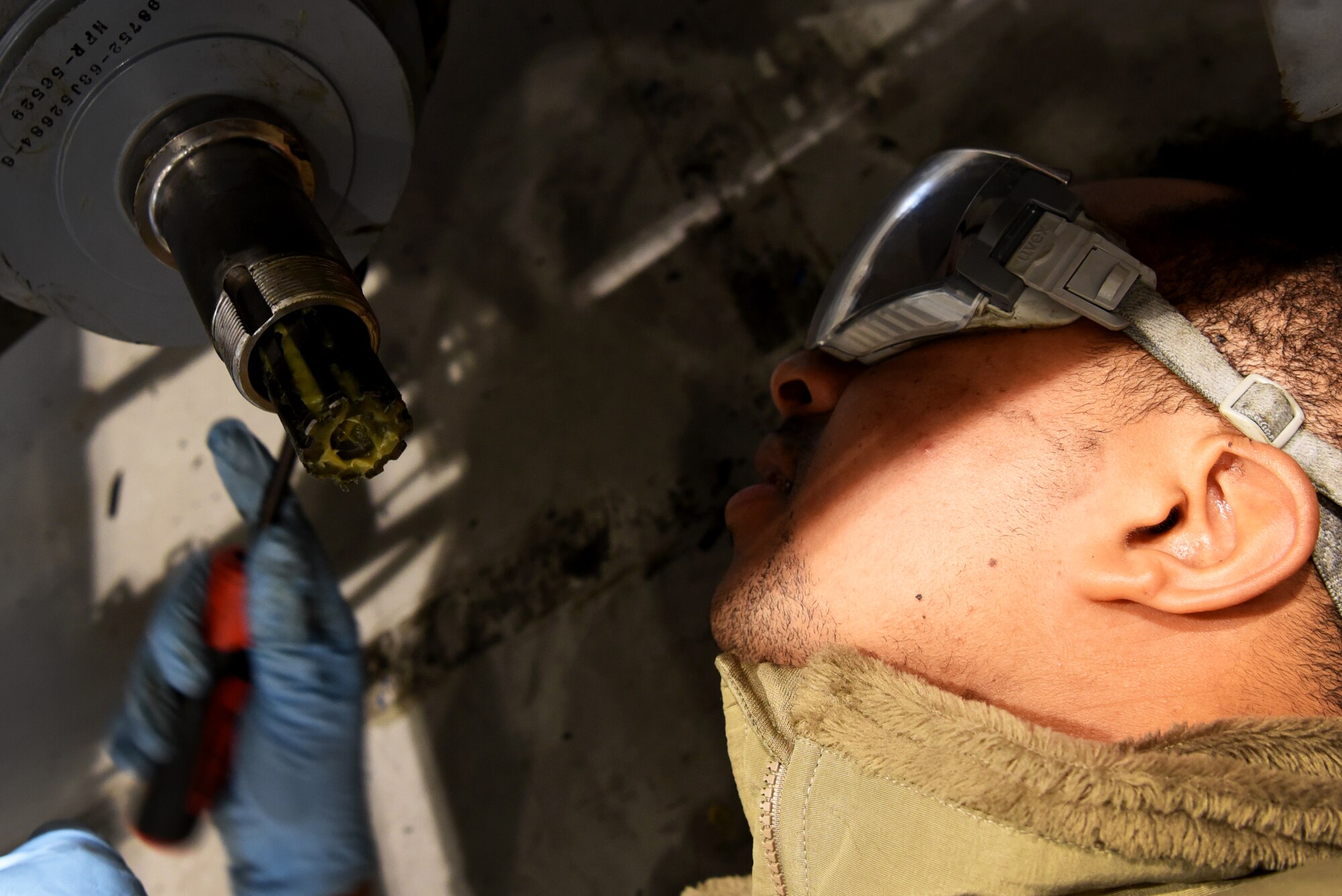 U.S. Air Force Senior Airman Dom Allen, 20th Equipment Maintenance Squadron aerospace ground equipment (AGE) technician, prepares to put a wheel on an a munitions jammer 1-B bomb lift at Shaw Air Force Base, S.C., Jan. 16, 2019.