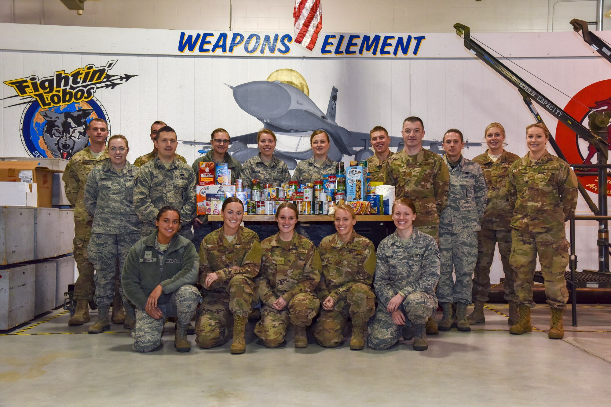 The 114th Aircraft Maintenance Squadron Weapons Element gave back to the hungry in South Dakota by donating canned goods they collected in their shop during the January unit training assembly and the money raised during a taco feed fundraiser in December to Feeding South Dakota.