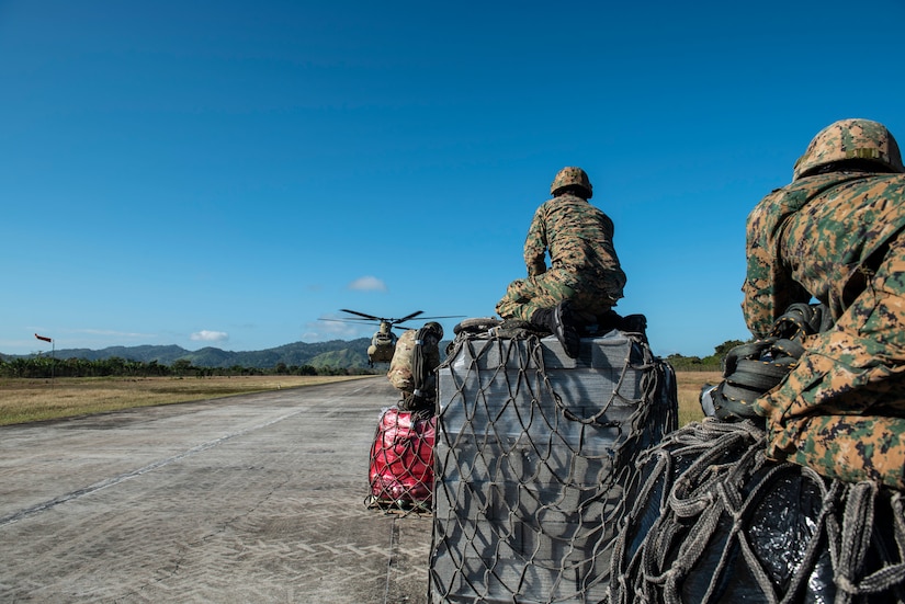 Agents from Panama’s National Border Service wait to load slings onto a U.S. Army CH-47 Chinook headed to the Darien Province in the Republic of Panama, Jan. 11, 2019.