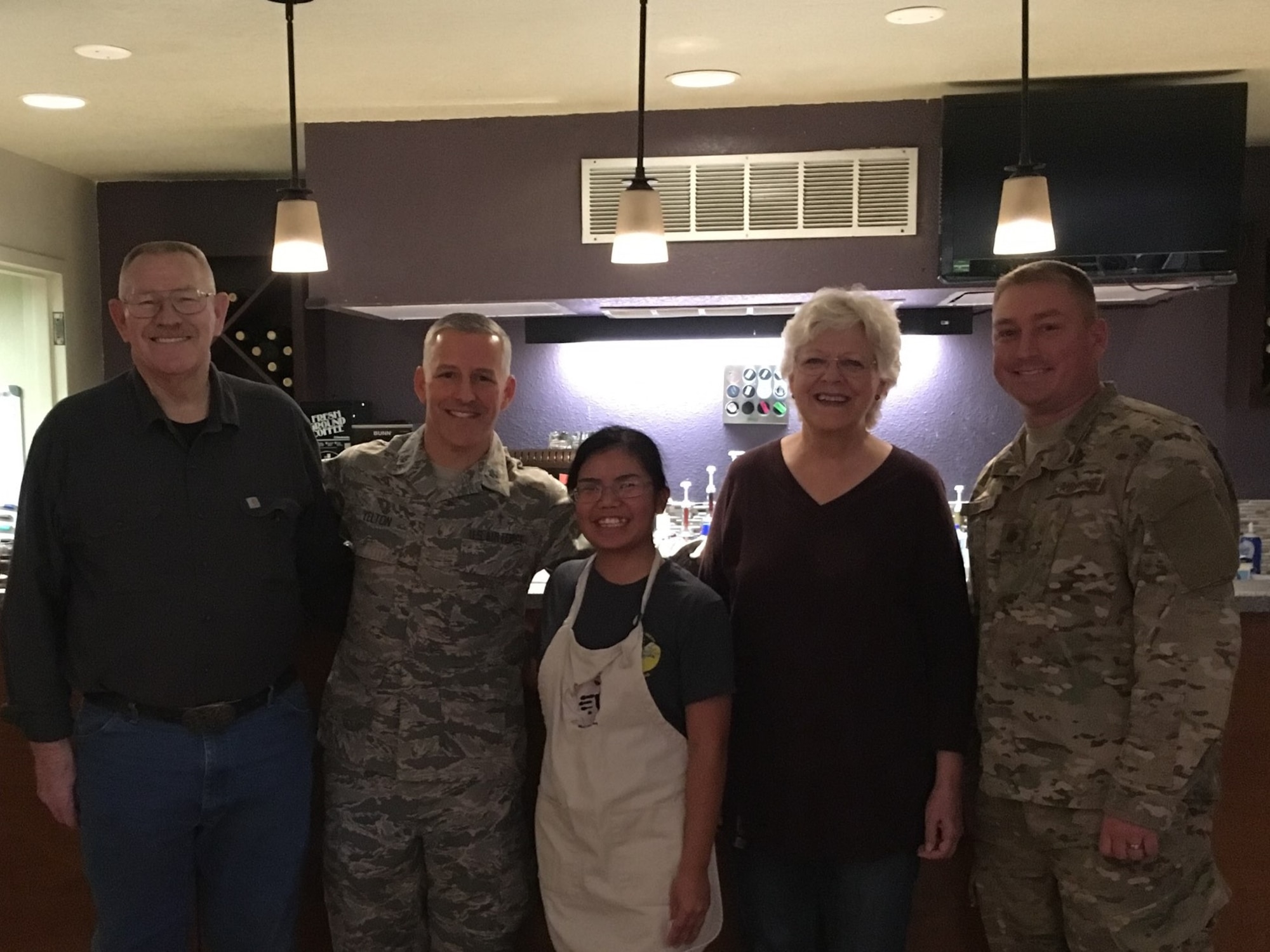 Airman 1st Class Femke Vargas, Refuel Cafe volunteer, was coined for excellent wingmanship, Oct. 5, 2018, at the Refuel Cafe on Holloman Air Force Base, N.M. Through making handcrafted beverages at her new home away from home, Vargas found her stride, improving the morale of other Airmen and developing leadership skills. (Courtesy photo by Staff Sgt. BreeAnn Sachs)