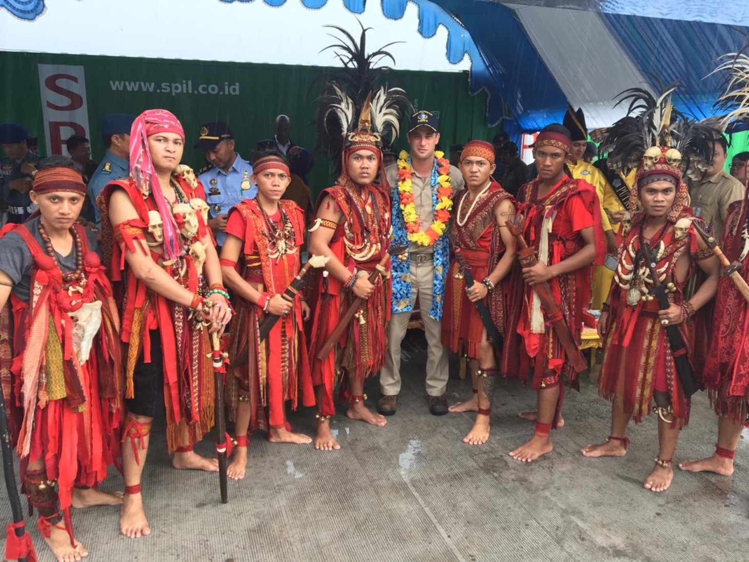Civilian mariner Capt. Adam Streeper, ship’s master of the expeditionary fast transport ship USNS Brunswick (T-EPF 6), meets with members of a local Minahasa dance troupe after the ship arrived in Bitung, Indonesia, for a scheduled port visit. Brunswick is one of three expeditionary fast transport ships in the U.S. 7th Fleet area of responsibility with a mission of providing rapid intra-theater transport of troops and military equipment.