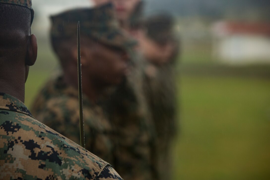 Sgt. Kirk Broxton looks over his Marines during a drill competition Jan. 16, 2019 at Roberts Field, Camp Kinser, Okinawa, Japan. Close order drill is conducted by the Navy and Marine Corps to teach simple formations, discipline and small unit leadership. This is the first drill competition Supply Battalion, Combat Logistics Regiment 35 has hosted and it will be held quarterly.