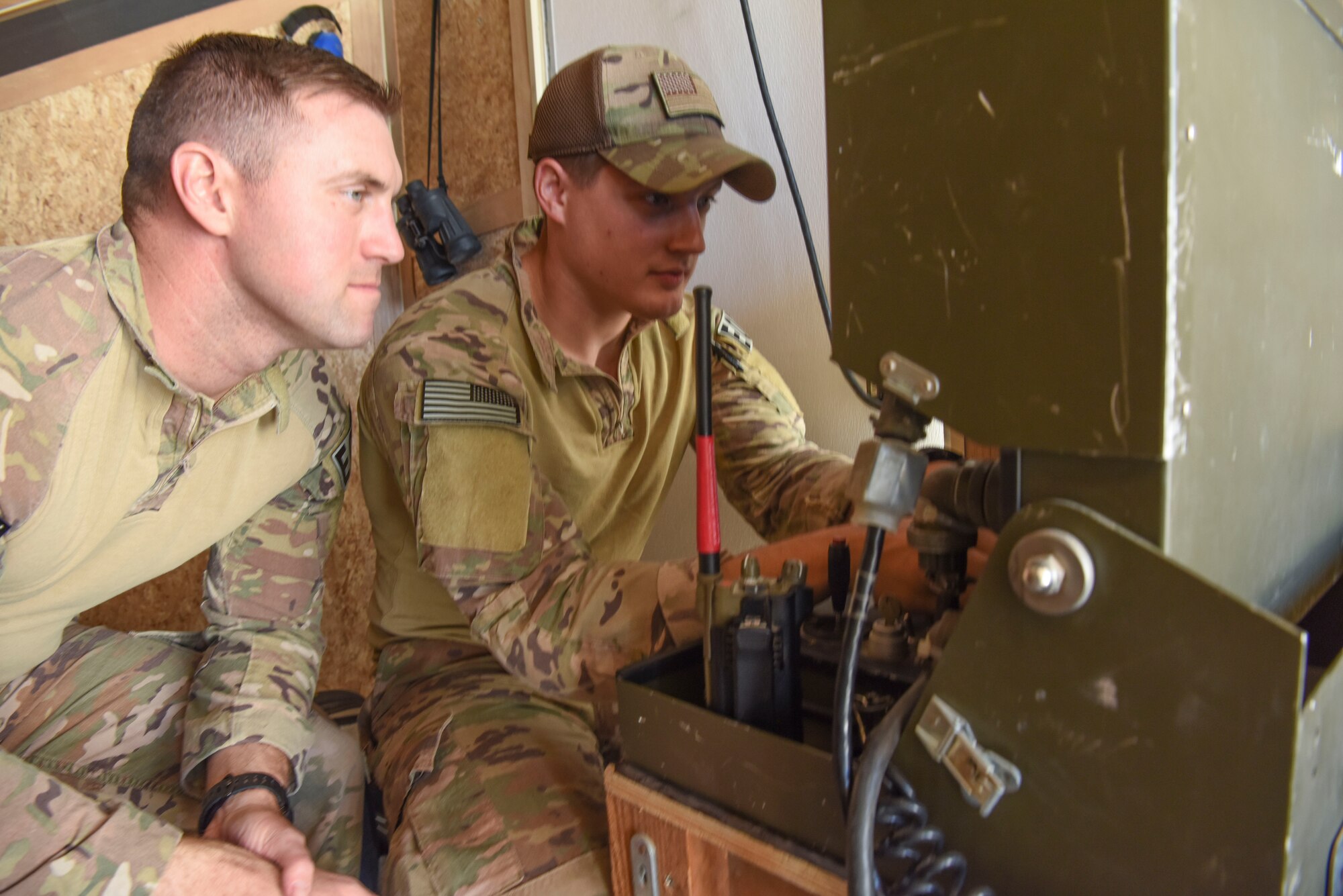 Senior Airman Zach Pennington, 380th Expeditionary Civil Engineer Squadron Explosive Ordinance Disposal team member, operates the robot while Staff Sgt. Mike Kealty, 380th ECES EOD team member, provides an additional set of eyes during a joint training event Jan. 15, 2019 at Al Dhafra Air Base, United Arab Emirates.