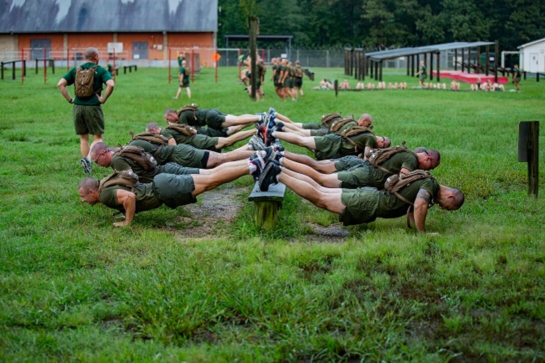 U.S. Marine officer candidates with Officer Candidate School (OCS), participate in an upper body strength training course on Marine Corps Base Quantico, Va., Sep. 18, 2018. The purpose of OCS is to train officer candidates in Marine Corps knowledge and skills within a controlled and challenging environment. (U.S. Marine Corps photo by Lance Cpl. Paige M. Verry)
