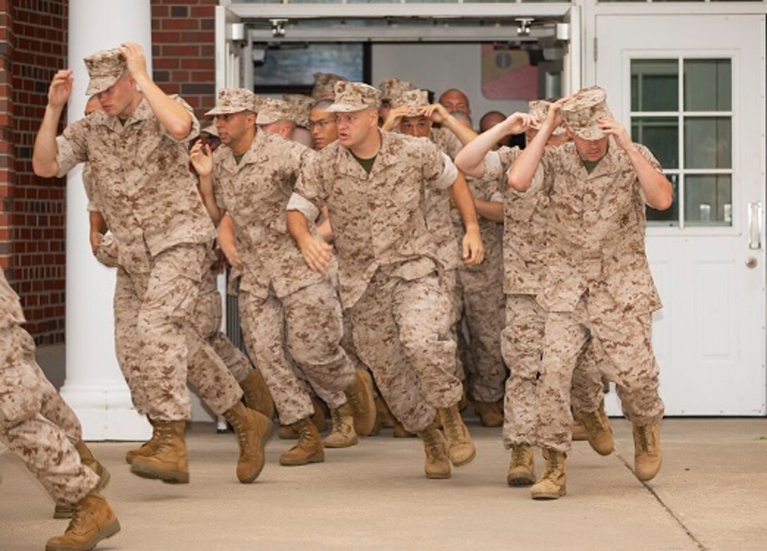 U.S. Marine candidates assigned to the Officer Candidates School undergo their initial brief at Marine Corps Base Quantico, Va., Sep. 13. 2018. Candidates were informed on what is expected of them during their training. (U.S. Marine Corps Photo by Pfc. Yuritzy Gomez)