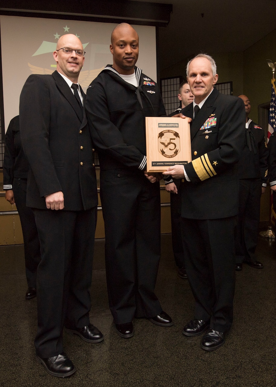 YOKOSUKA, Japan (Jan, 17 2019) - Vice Adm. Phil Sawyer(right), along with Fleet Master Chief Tobi Howat(left), poses with Electronic Technician 1st Class Terrence Washington at the announcement luncheon during 7th Fleet Sailor of the Year competition. The 7th Fleet Sailor of the Year Week is designed to share with these outstanding Sailors the unique operational environment in the 7th Fleet as well as enhance regional partnerships with like-minded forces.