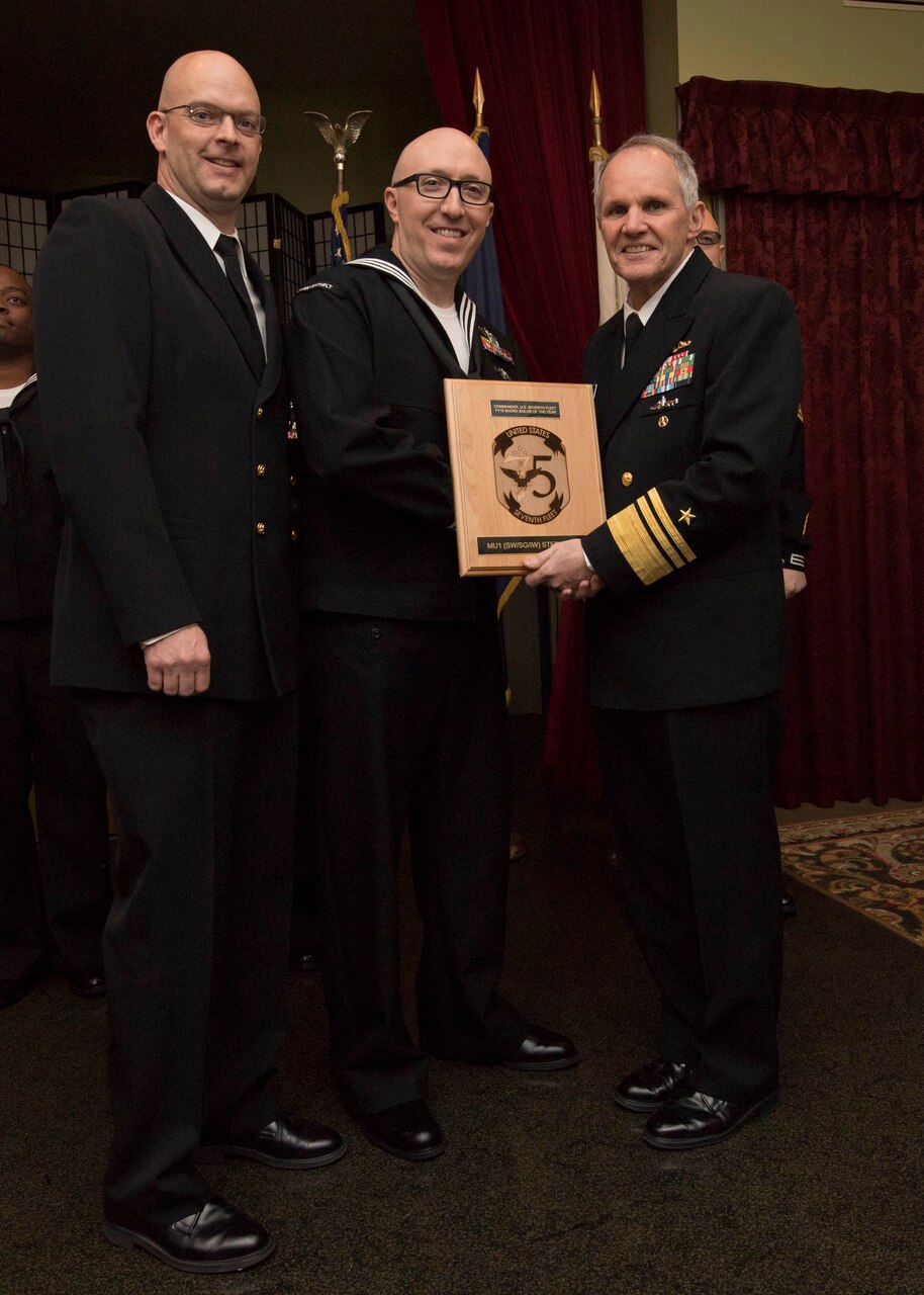 YOKOSUKA, Japan (Jan, 17 2019) - Vice Adm. Phil Sawyer(right), along with Fleet Master Chief Tobi Howat (left), poses with Musician First Class Stephen Hux at the announcement luncheon during 7th Fleet Sailor of the Year competition. The 7th Fleet Sailor of the Year Week is designed to share with these outstanding Sailors the unique operational environment in the 7th Fleet as well as enhance regional partnerships with like-minded forces.