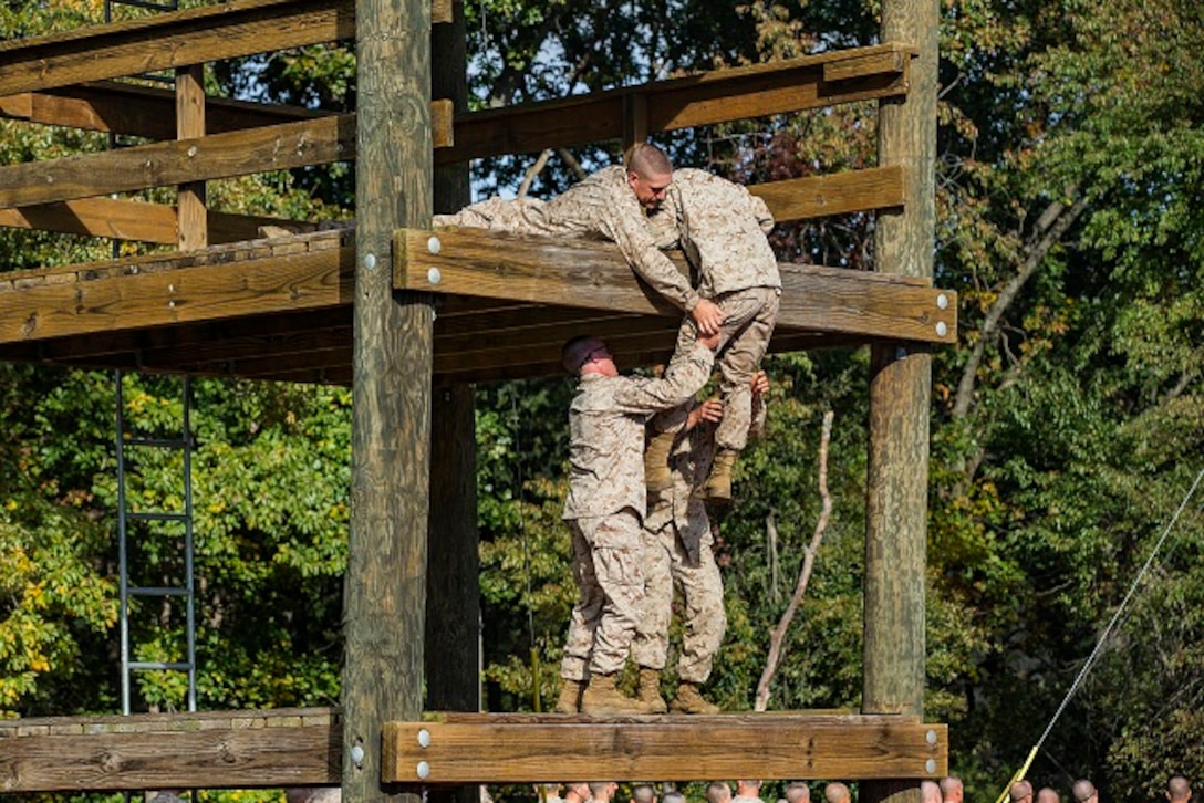 U.S. Marine officer candidates with the Officer Candidate School (OCS), Delta Company, participate in the Confidence and Tarzan courses at Marine Corps Base Quantico, Va., Oct. 29, 2018. The mission of OCS is to educate and train officer candidates in order to evaluate and screen individuals for qualities required to become commissioned as a Marine Corps Officer. (U.S. Marine Corps photo by Lance Cpl. Yuritzy Gomez)