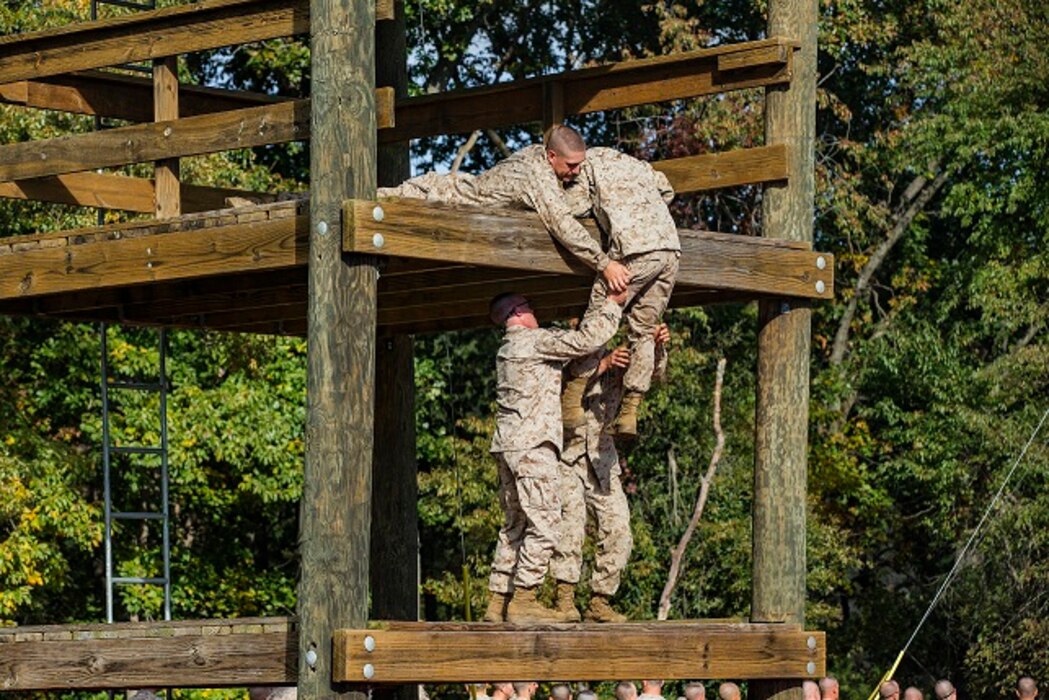 U.S. Marine officer candidates with the Officer Candidate School , Delta Company, participate in the Confidence and Tarzan courses at Marine Corps Base Quantico, Va. The mission of OCS is to educate and train officer candidates in order to evaluate and screen individuals for qualities required to become commissioned as a Marine Corps Officer.