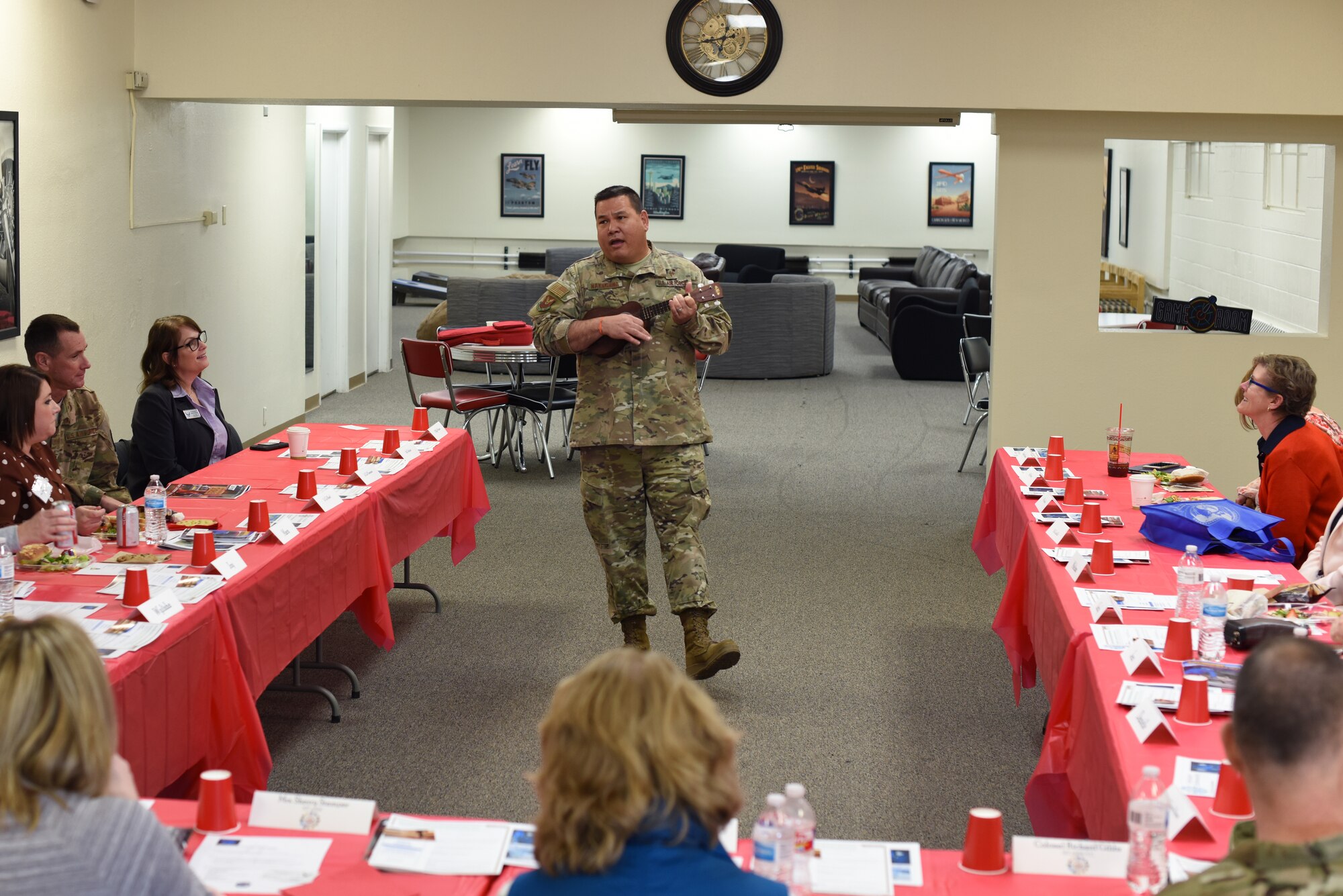 U.S. Air Force Chap. (Maj.) Craig Nakagawa, 377th Air Base Wing deputy wing chaplain, plays the ukulele at a senior spouse immersion tour at Kirtland Air Force Base, N.M., Jan. 15, 2019. The tour included visits to key areas around Kirtland, with the intent of familiarizing spouses on the base to better equip them in assisting Airmen and their families. (U.S. Air Force photo by Senior Airman Eli Chevalier)