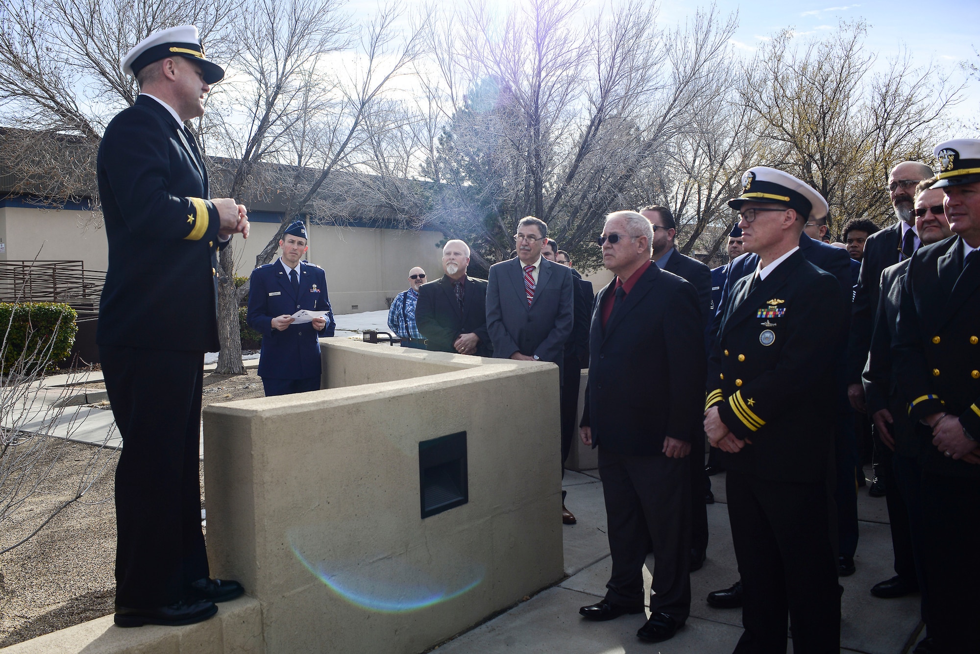 Rear Adm. John Spencer, Defense Threat Reduction Agency Nuclear Enterprise director, speaks during a dedication ceremony at the Defense Nuclear Weapons School at Kirtland Air Force Base, N.M., Jan. 10. During his speech, Spencer spoke about the 72 years of history throughout the schoolhouse and what it means to have the new replica of the iconic Mk6 Atomic Bomb training device in front of it. (U.S. Air Force photo by Staff Sgt. Kimberly Nagle)