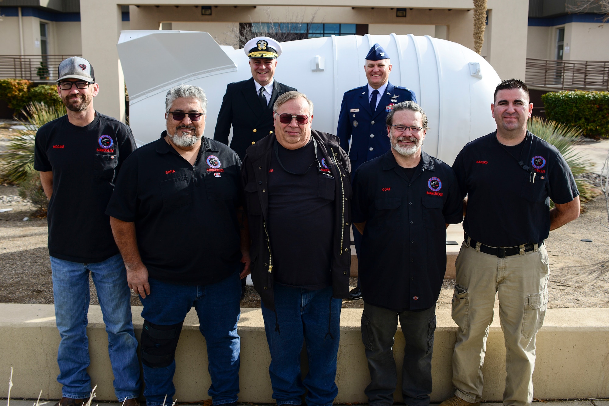 Leadership from the Defense Threat Reduction Agency and Defense Nuclear Weapons School pose with members of the 58th Special Operations Wing’s Monster Garage after the dedication of an iconic Mk6 Atomic Bomb replica that was unveiled in front of the schoolhouse at Kirtland Air Force Base, N.M., Jan. 10, 2019. The idea for the new icon for the school was to remind people that the schoolhouse was there,
full of history. (U.S. Air Force photo by Staff Sgt. Kimberly Nagle)