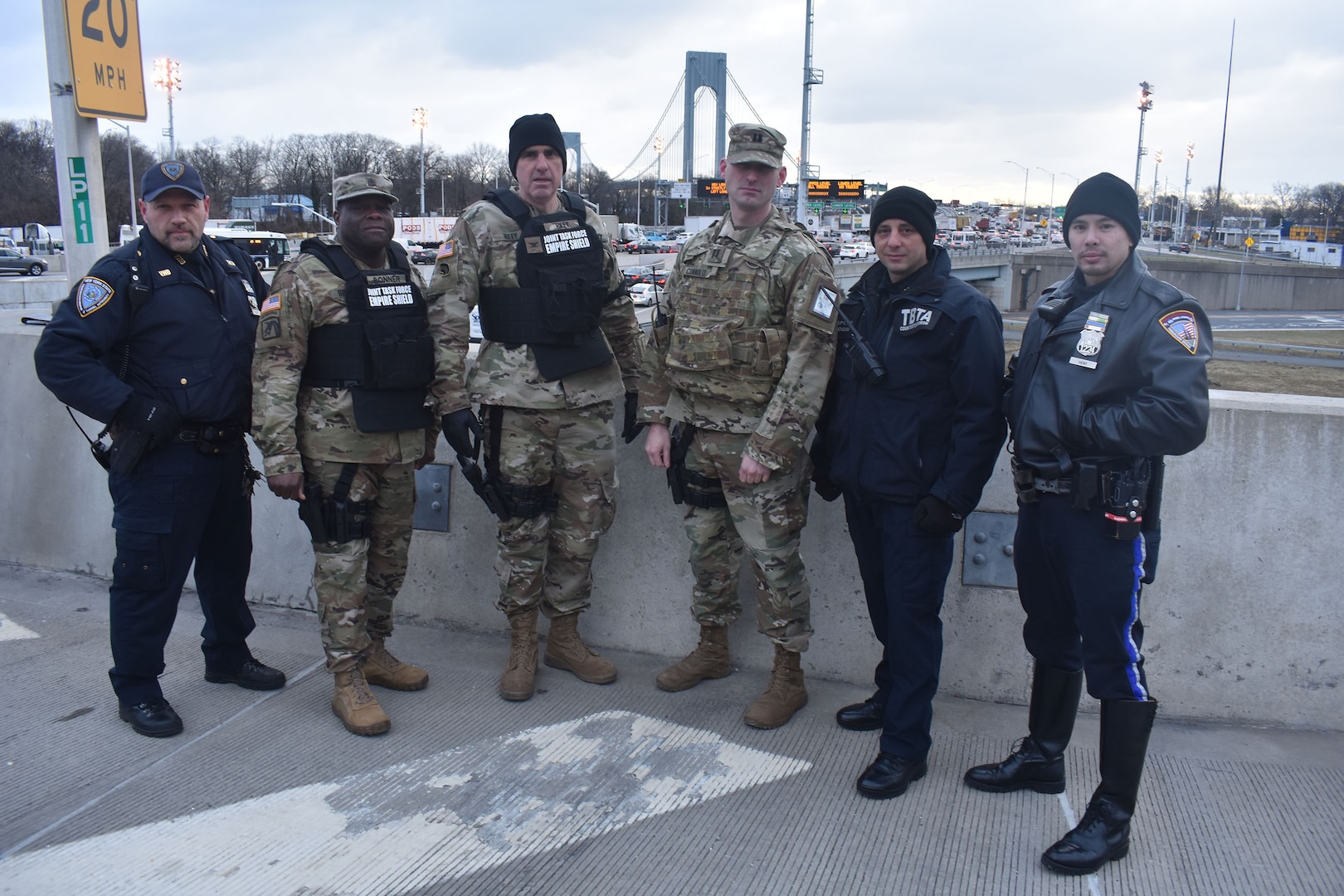 New York National Guard Soldiers of Joint Task Force Empire Shield stand with Triburough Bridge and Tunnel Authority officers and State Troopers, at the Verrazano Bridge, Staten Island, N.Y., Jan. 10, 2019. Soldiers and Troopers were conducting Operation Catch-All, a security operation to prevent terrorism in New York City and the Triburough area.