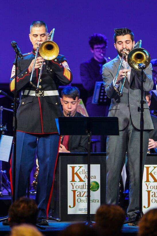 U.S. Marine Corps Gunnery Sgt. Ken Ebo, a musical technical assistant for the 8th Marine Corps District, performs alongside a high school musician from the Keller school district, during the Keller Area Youth Jazz Orchestra concert at Venture Church in Keller, Texas, on Jan. 6.