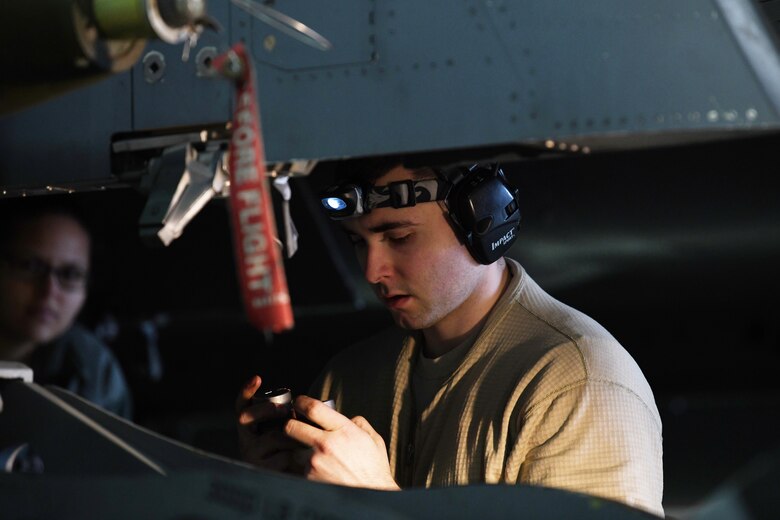 A 492nd Aircraft Maintenance Unit load crew member secures ordinance during the 48th Fighter Wing 2018 Load Crew of the Year competition at Royal Air Force Lakenheath, England, Jan. 18, 2019. The 492nd, 493rd and 494th Aircraft Maintenance Units were given 30 minutes to complete a demonstration load. (U.S. Air Force photo by Airman 1st Class Shanice Williams-Jones)