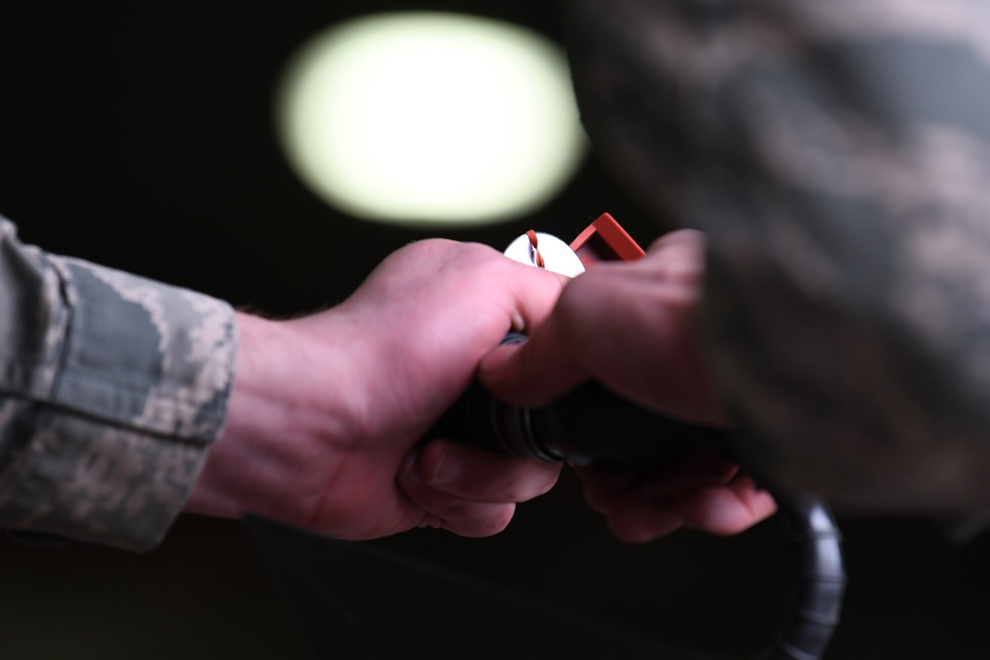 A 492nd Aircraft Maintenance Unit load crew member secures ordinance during the 48th Fighter Wing 2018 Load Crew of the Year competition at Royal Air Force Lakenheath, England, Jan. 18, 2019. The 492nd, 493rd and 494th Aircraft Maintenance Units were given 30 minutes to complete a demonstration load. (U.S. Air Force photo by Airman 1st Class Shanice Williams-Jones)