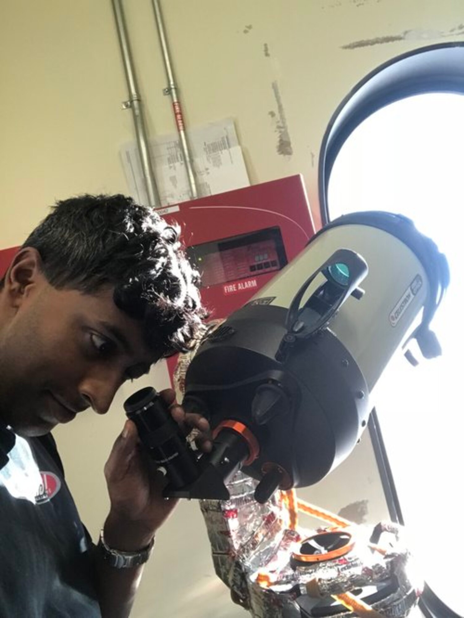 Capt. Michael Nayak, an AFRL scientist, tests the ability of the telescope (and the operator) to acquire and track stars during the daytime. This is a very demanding task due to the bright reflections from the ice. (Courtesy photo)