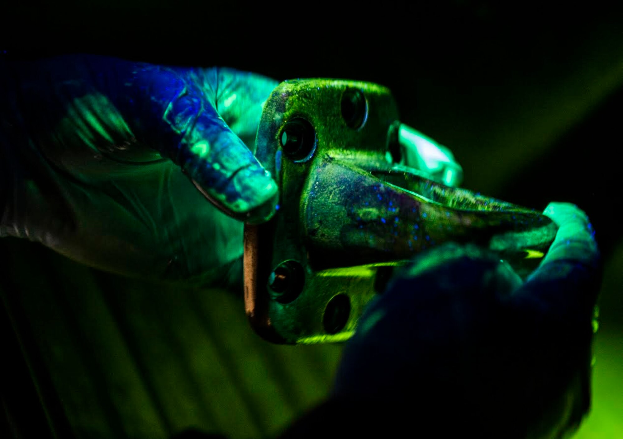 U.S. Air Force Airman 1st Class Colin Lanterman, 20th Equipment Maintenance Squadron non-destructive inspection apprentice, checks for any cracks under a black light at Shaw Air Force Base, S.C., Jan. 15, 2019.