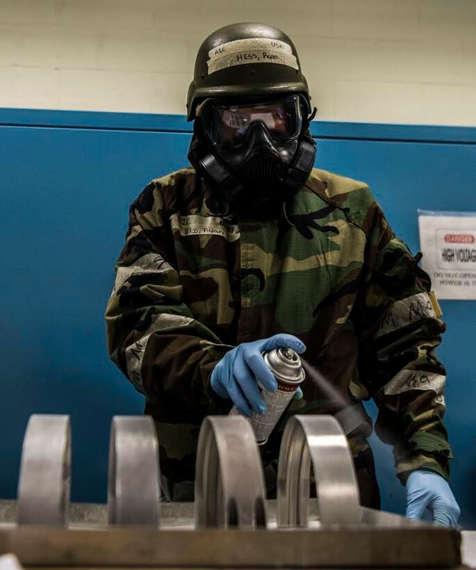 U.S. Air Force Airman 1st Class Ryan Hess, 20th Equipment Maintenance Squadron (EMS) non-destructive inspection apprentice, sprays down metal parts to prepare them for inspection at Shaw Air Force Base, S.C., Jan. 15, 2019.
