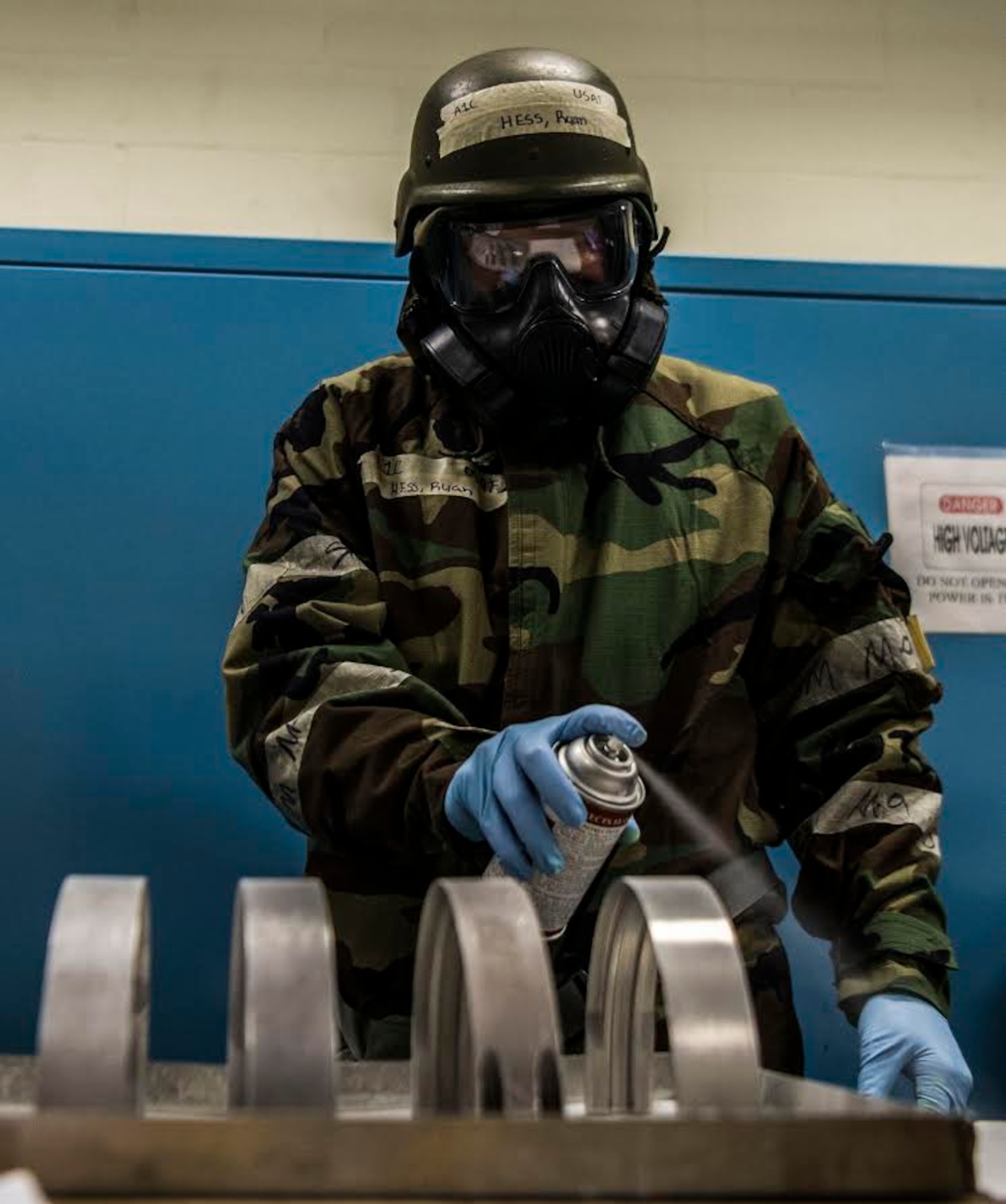 U.S. Air Force Airman 1st Class Ryan Hess, 20th Equipment Maintenance Squadron (EMS) non-destructive inspection apprentice, sprays down metal parts to prepare them for inspection at Shaw Air Force Base, S.C., Jan. 15, 2019.