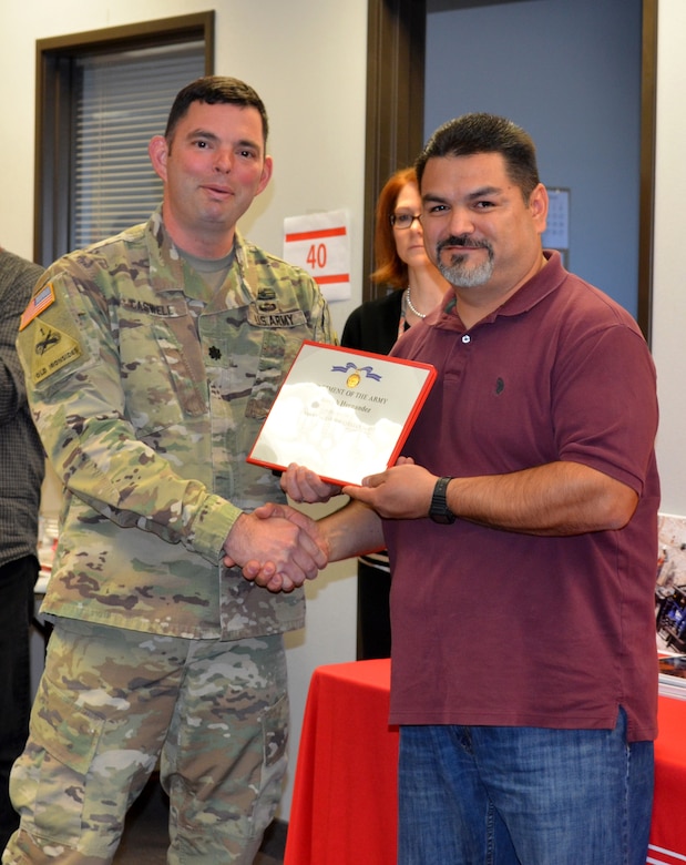 Albuquerque District Commander Lt. Col. Larry Caswell recognizes Joseph Hernandez as the District Office's Employee of the Year, Dec. 12, 2018.