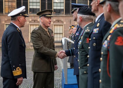 Marine Corps Gen. Joe Dunford, chairman of the Joint Chiefs of Staff, participates in an arrival ceremony with his counterpart, Dutch Lt. Adm. Rob Bauer, chief of defense of the Armed Forces of the Netherlands, at the Binnenhof in the Hague, Jan. 18, 2019.