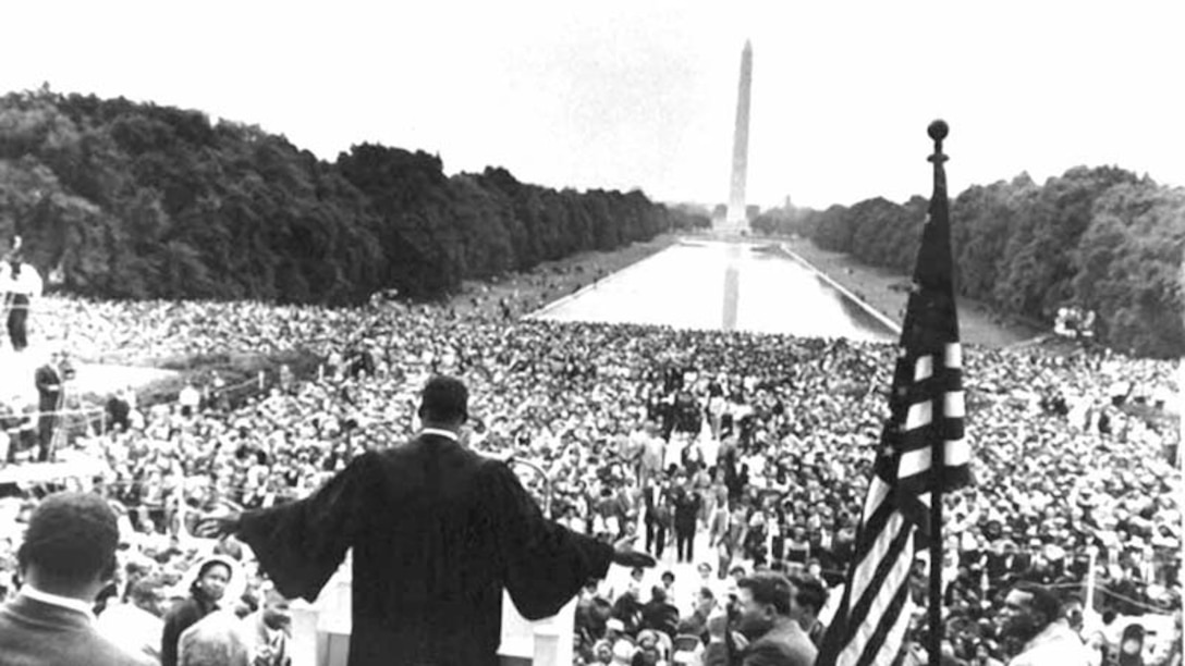 Dr. Martin Luther King Jr. speaks to a large crowd in front of Lincoln Memorial.