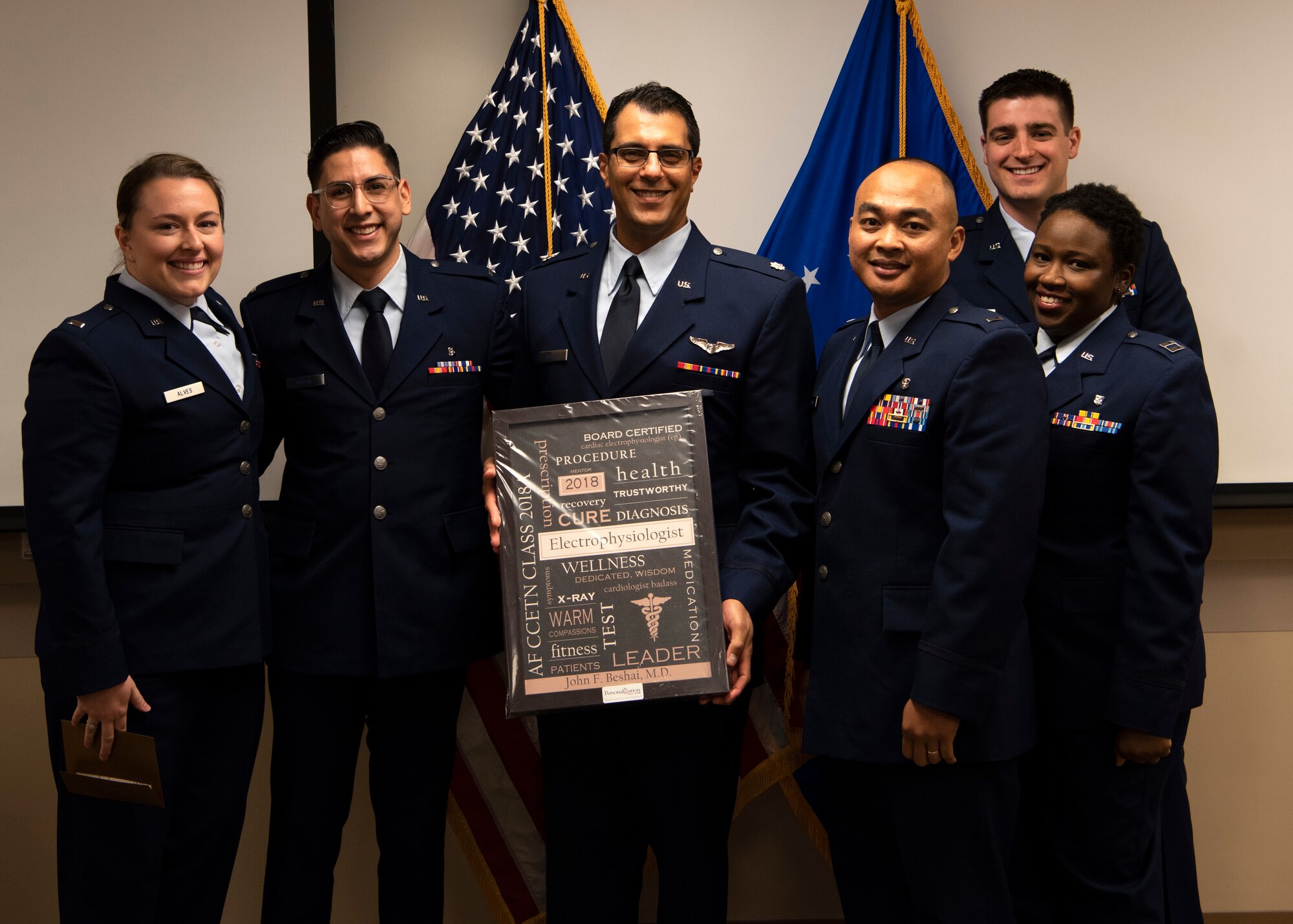 Critical Care and Emergency Trauma Nursing Fellowship Class 18A graduates stand with Lt. Col. John Beshai, 944th Aeromedical Staging Squadron flight surgeon and guest speaker, after their graduation ceremony at Honor Health Scottsdale Healthcare Osborn Medical Center in Scottsdale, Ariz., Jan. 17, 2019.