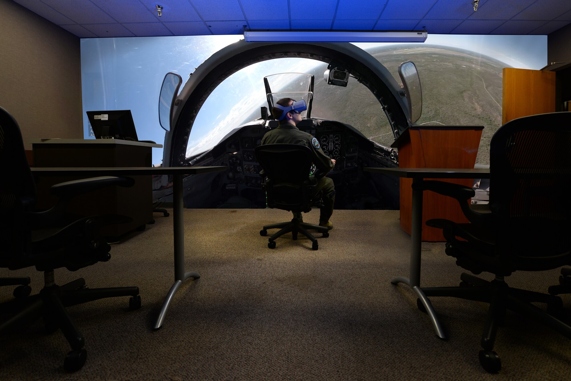 A student pilot assigned to the 87th Flying Training Squadron, immerses himself into a prototype virtual reality training solution at Laughlin Air Force Base, Texas, Jan. 16, 2019. Instructor pilots from the 87th Flying Training Squadron, like Capt. Jason Dark, are looking to boost traditional classroom lessons on aircraft maneuvers and provide a better course for students with the help of virtual reality. (U.S. Air Force illustration by Senior Airman Benjamin N. Valmoja)