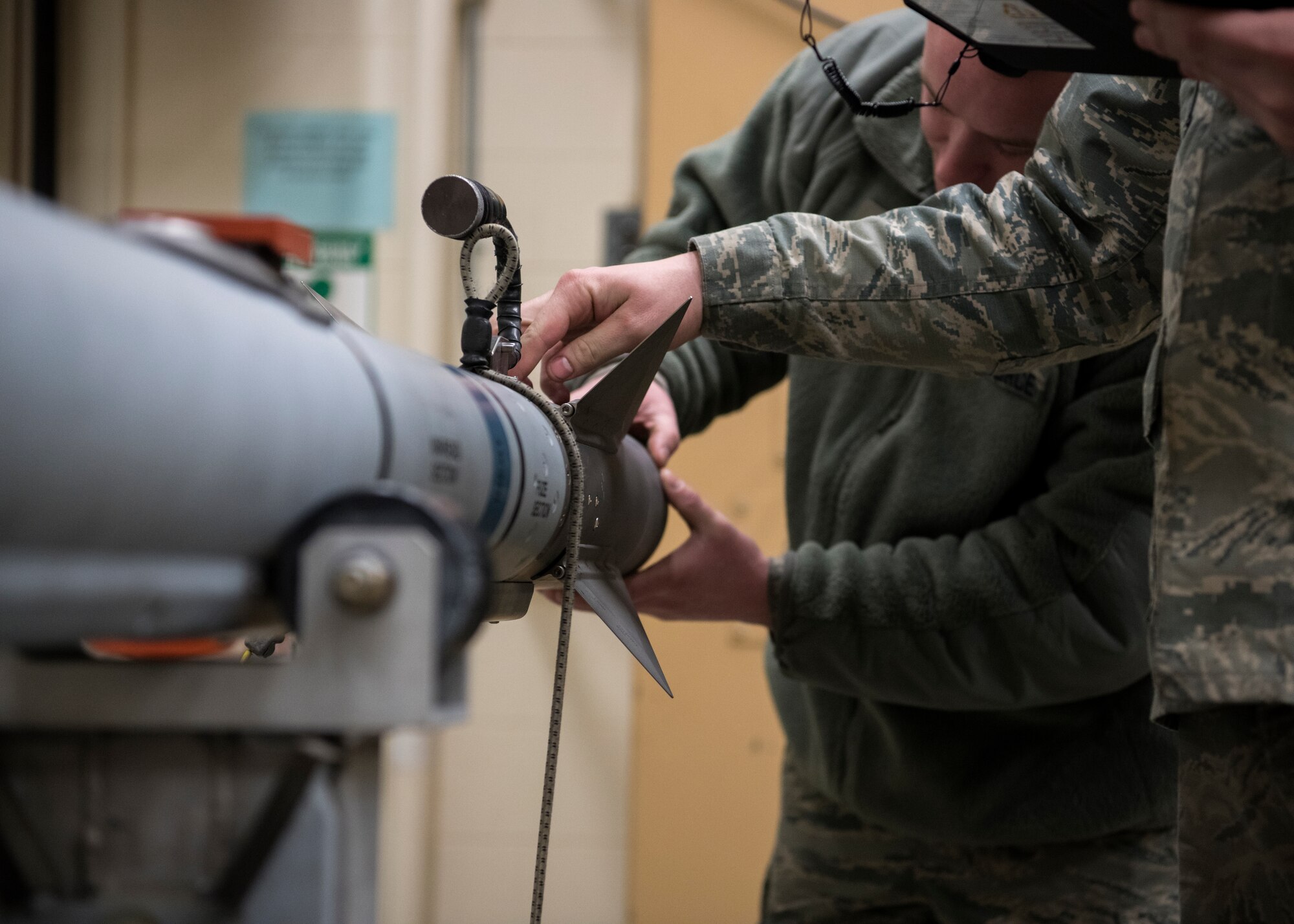 Senior Airman Alec Leavitt and Airman 1st Class Nick Burns, 104th Munitions Flight ordnance mechanics, conduct a 60 day inspection on a Captive Air Training Missile 9X-2, Jan. 16, 2018, at Barnes Air National Guard Base, Massachusetts. The CATM 9X-2 recently replaced the CATM 9X used by F-15 Eagles at the 104th Fighter Wing, and provides improved capabilities. (U.S. Air National Guard photo by Airman 1st Class Randy Burlingame)