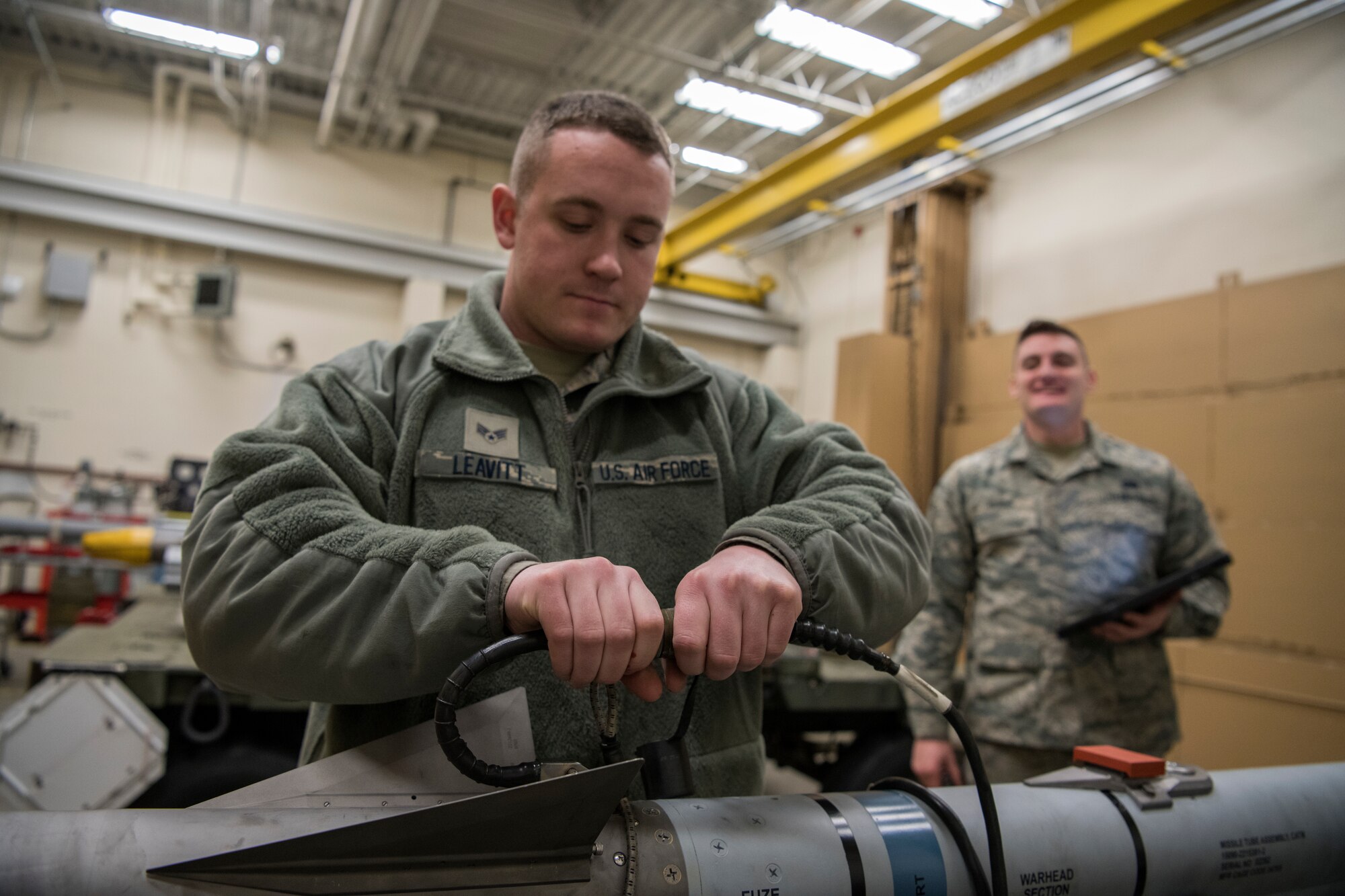 Senior Airman Alec Leavitt and Airman 1st Class Nick Burns, 104th Munitions Flight ordnance mechanics, conduct a 60 day inspection on a Captive Air Training Missile 9X-2, Jan. 16, 2018, at Barnes Air National Guard Base, Massachusetts. The inspection is done to validate servicability. (U.S. Air National Guard photo by Airman 1st Class Randy Burlingame)