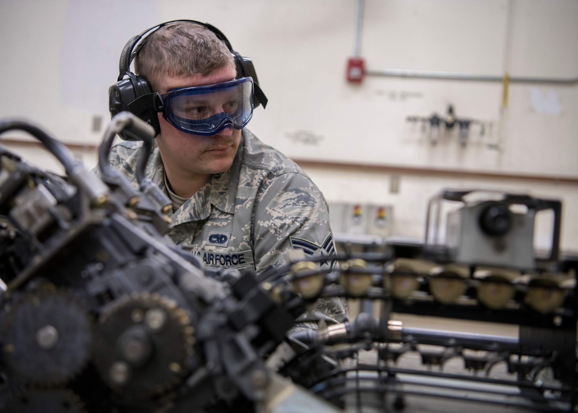 Staff Sergeant Kyle Bienia, 104th Munitions Flight Airman, helps load 20mm ammunition into a Universal Ammunition Loading System Jan. 16, 2018, at Barnes Air National Guard Base, Massachusetts. Bienia and the rest of the Airmen in the 104th MF are trained in all areas of munitions operations, to include inspection, line delivery and storage. (U.S. Air National Guard photo by Airman 1st Class Randy Burlingame)