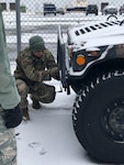 New York Air National Guard Master Sgt. Peyton Knippel, assigned to the 174th Attack Wing, prepares a humvee for a snow storm response missoion as  Hancock Field Air National Guard Base , Syracuse, N.Y. on Jan. 18, 2019. The New York National Guard alerted 450 Airmen and Soldiers for possible missions as a major snow storm approached New York.