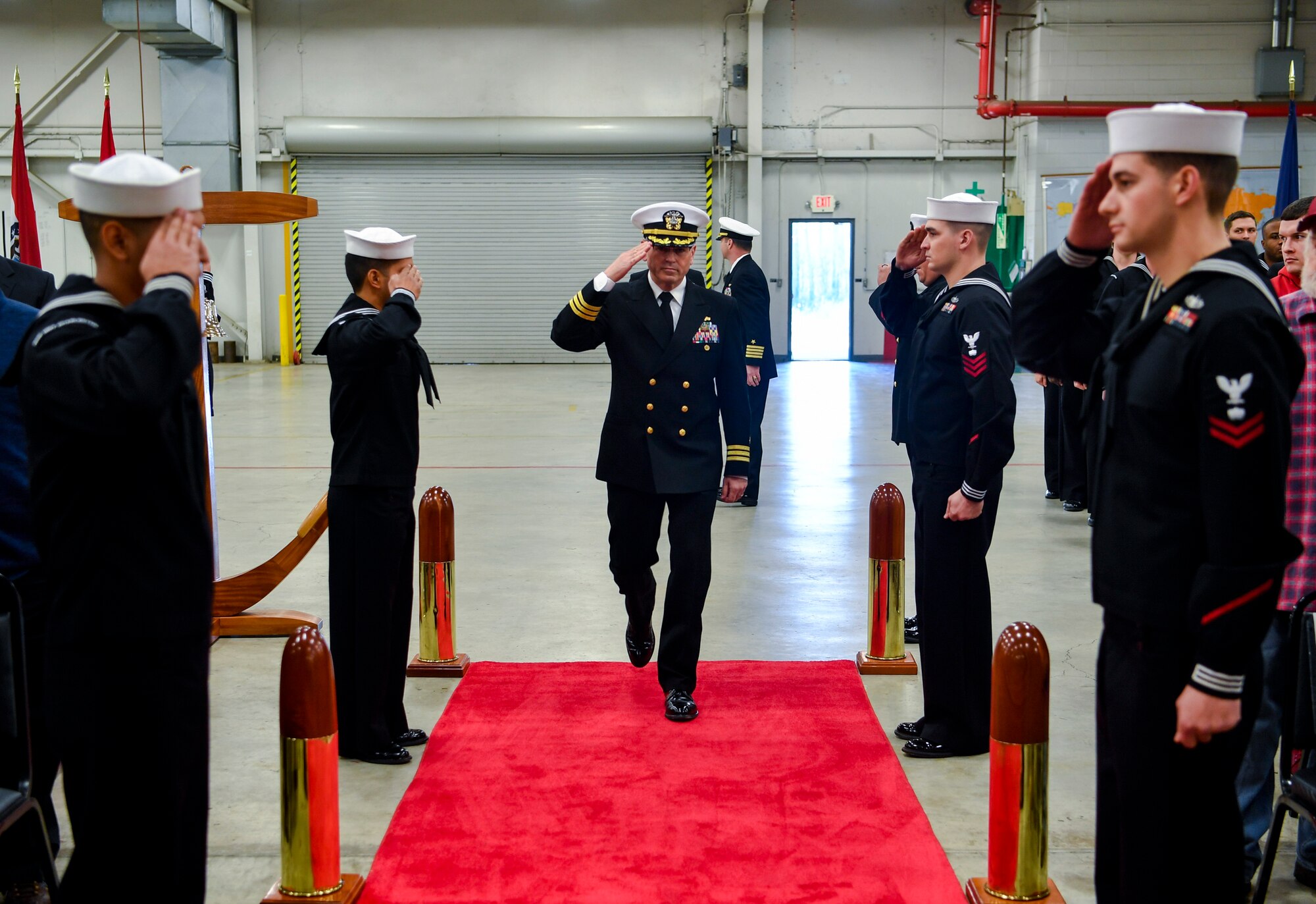 Cmdr. William Edenbeck, Navy Munitions Command Atlantic Unit Charleston commanding officer, salutes the Sideboys before a change of command ceremony Jan. 16, 2018, at Joint Base Charleston, S.C.