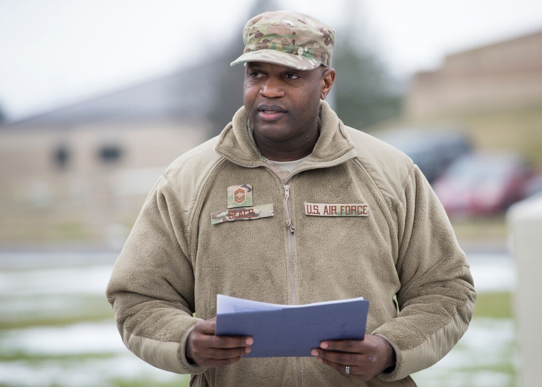 Chief Master Sgt. Damien Seals, 436th Civil Engineer Squadron emergency management flight chief, speaks during the Martin Luther King Jr. Unity Walk Jan. 18, 2019, on Dover Air Force Base, Del. Seals spoke about the importance of unity and standing together, regardless of our differences. (U.S. Air Force photo by Staff Sgt. Jared Duhon)