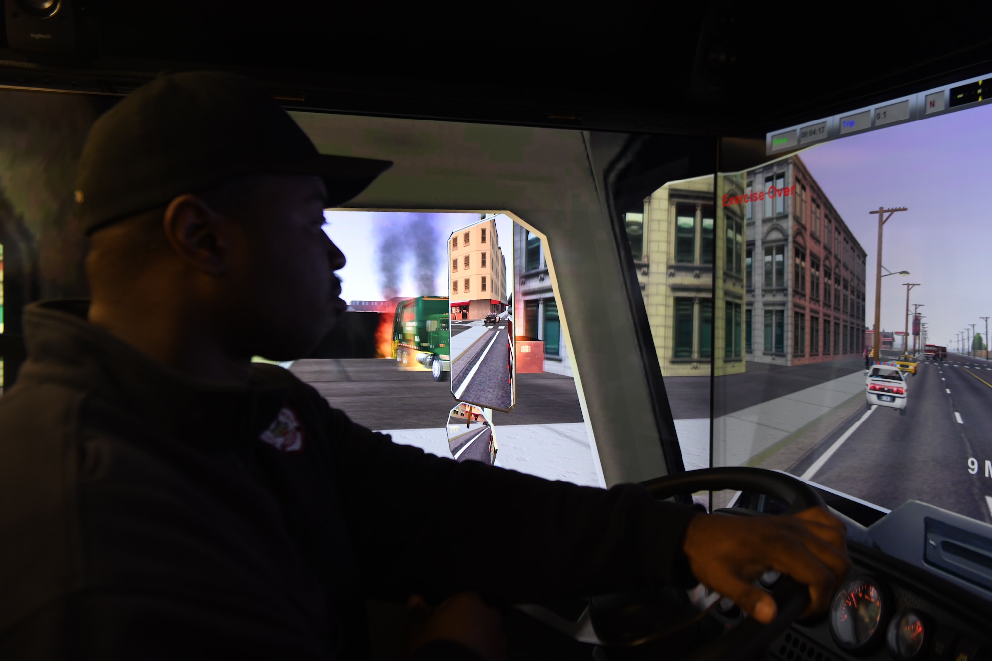 Jonathan Matthews, a firefighter assigned to the 97th AMW Fire Department, drives a firetruck driving simulator Jan. 15, 2019, at Altus Air Force Base, Okla. The simulator comes with scenarios built in, but can also be customized for brand new scenarios, allowing firefighters to hone their skills in a variety of situations. (U.S. Air Force photo by Airman 1st Class Jeremy Wentworth)