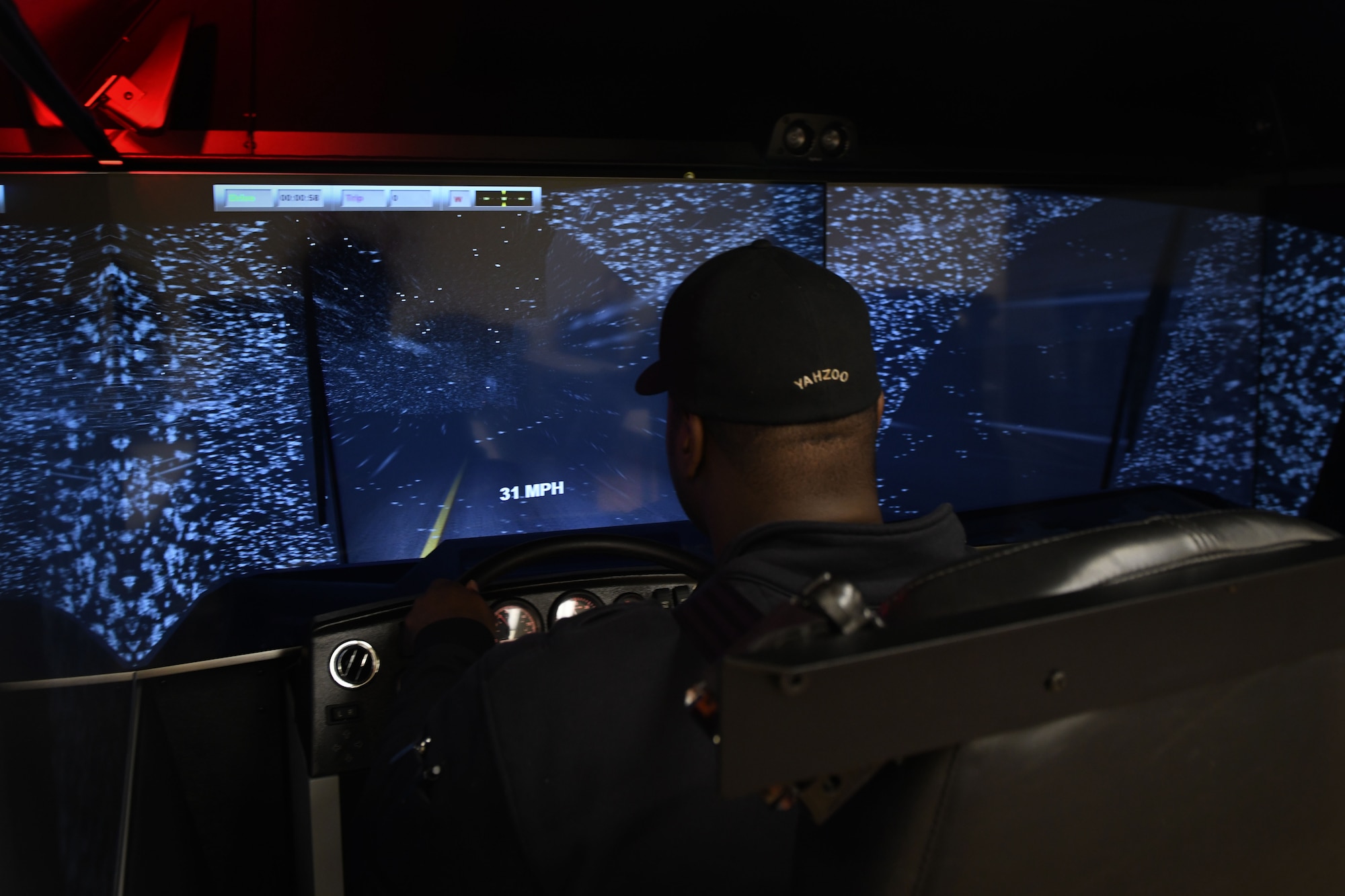 Jonathan Matthews, a firefighter assigned to the 97th AMW Fire Department, drives a firetruck driving simulator Jan. 15, 2019, at Altus Air Force Base, Okla. The operator can change the weather conditions so the driver can learn how to drive in poor conditions. (U.S. Air Force photo by Airman 1st Class Jeremy Wentworth)