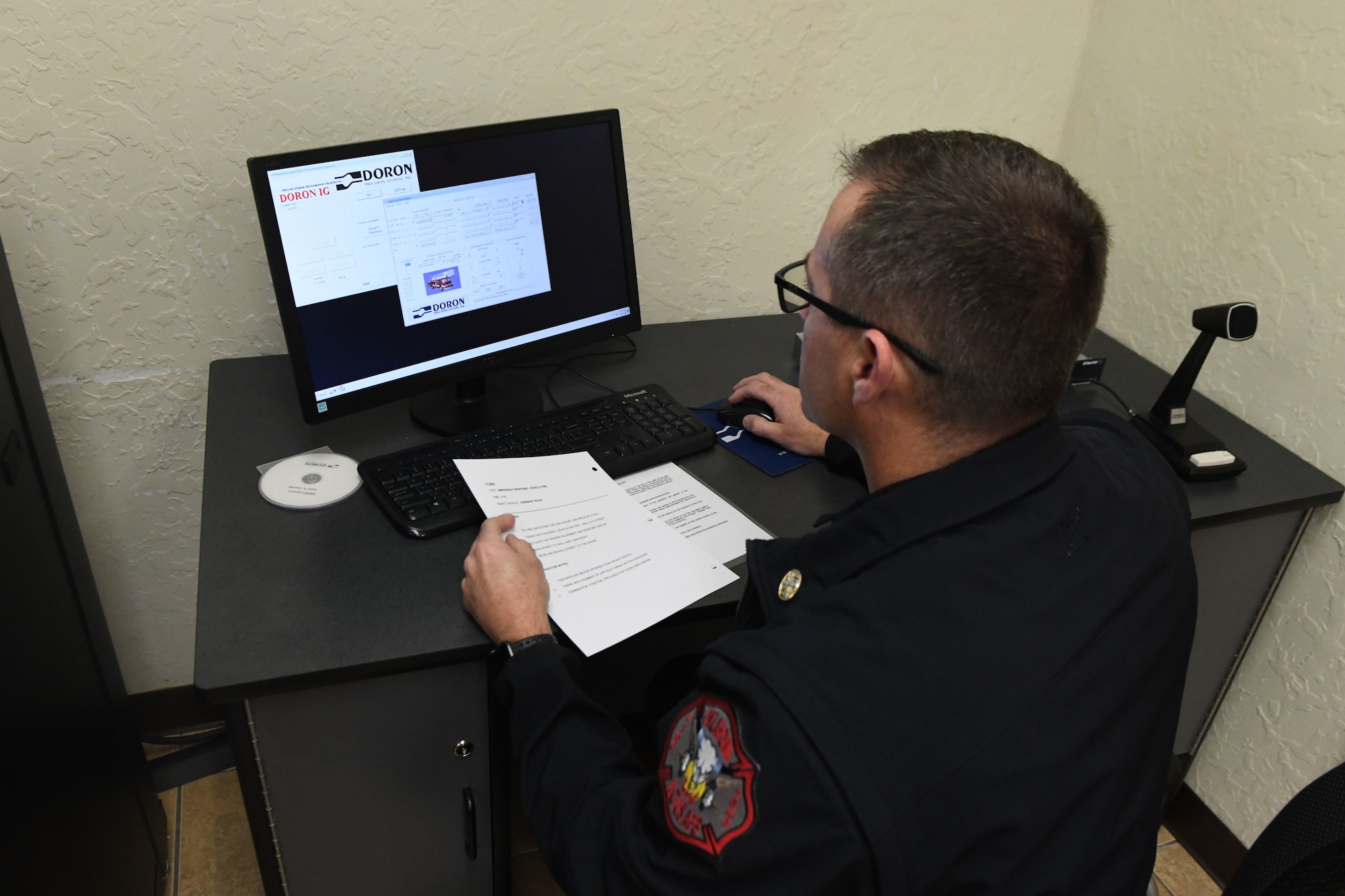 Philip Fourroux, the fire chief assigned to the 97th Air Mobility Wing Fire department, prepares a driving simulation scenario, Jan. 15, 2019, at Altus Air Force Base, Okla. The simulator allows firefighters to train on driving skills without putting wear on the actual vehicles. (U.S. Air Force photo by Airman 1st Class Jeremy Wentworth)