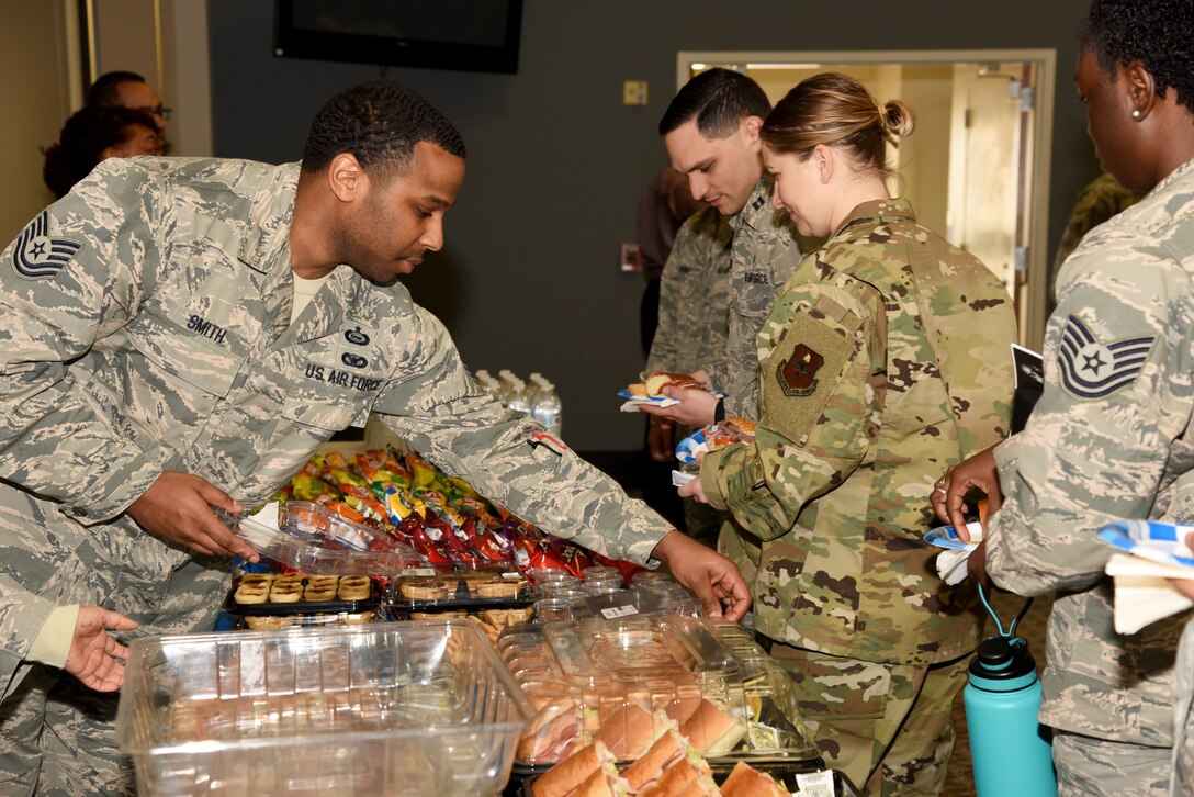U.S. Air Force Tech. Sgt. Eugene Smith III, 315th Training Squadron instructor, prepares food while volunteering with the 17th Training Wing Equal Opportunity at the Dr. Martin Luther King Jr. Day luncheon at the Event Center on Goodfellow Air Force Base, Texas, Jan. 17, 2019.  EO hosted the event with assistance from the local community. (U.S. Air Force Photo by Airman 1st Class Abbey Rieves/Released)