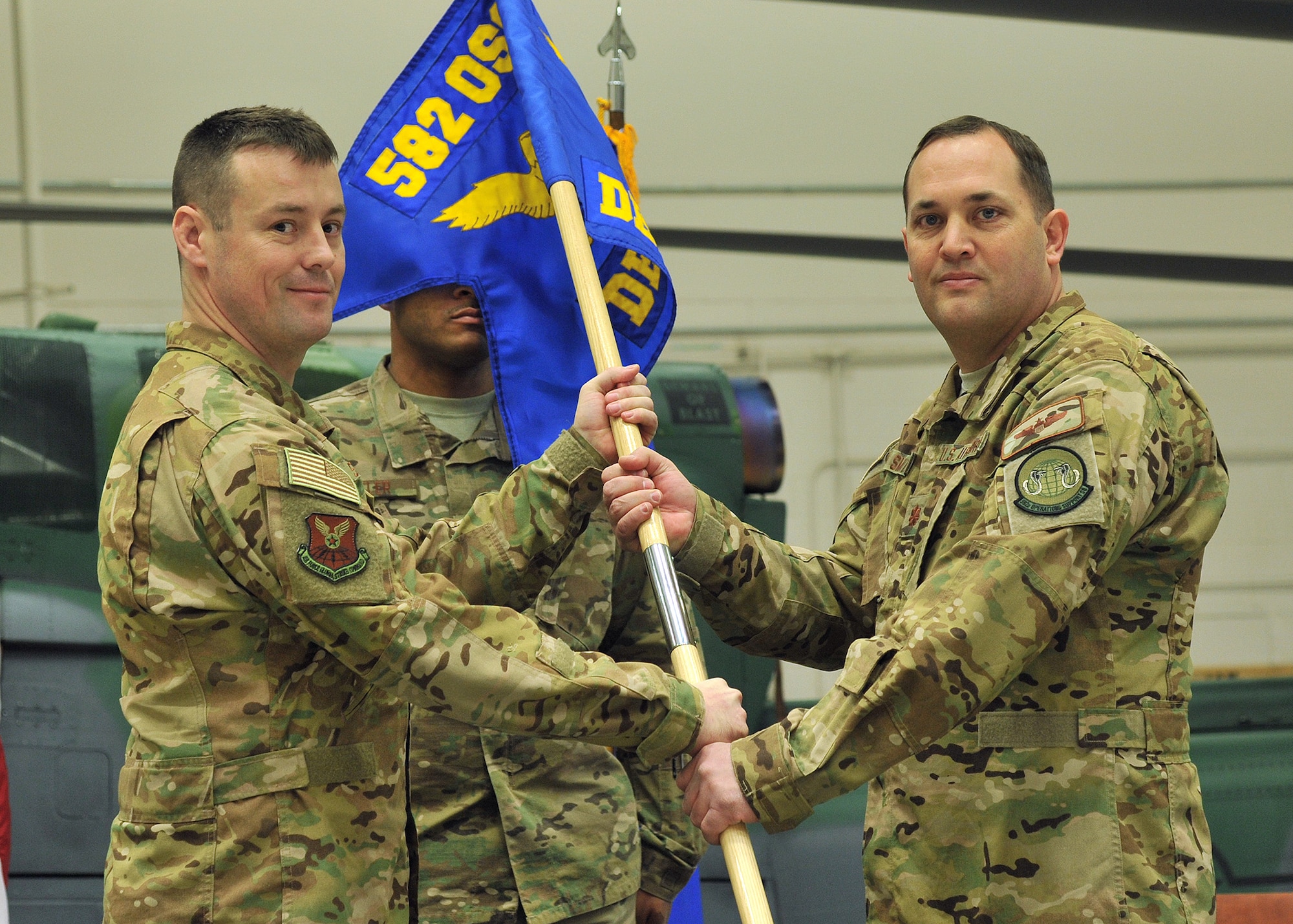 Maj. Cas Smith, right, accepts command of the 582nd Operations Support Squadron, Detachment 4, from Lt. Col. Todd Springer, 582nd OSS commander, Jan. 18, 2019, at Malmstrom AFB, Mont. (U.S. Air Force photo by John Turner)
