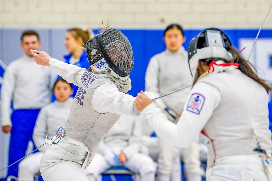 An Air Force Academy cadet competes in a fencing match.