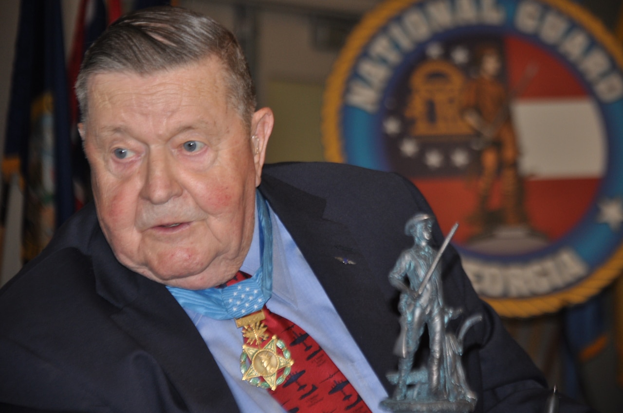 Colonel Joe M. Jackson addresses a gathering of Soldiers and Airmen of the Georgia National Guard nearly 44-years to the day after earning the Medal of Honor for combat actions during the Vietnam War. Jackson, an Air Force aviator, veteran of World War II, Korea, and Vietnam recounted a 33-year career of military service and sacrifice. Jackson died Jan 12, 2019 at his home in Washington State.